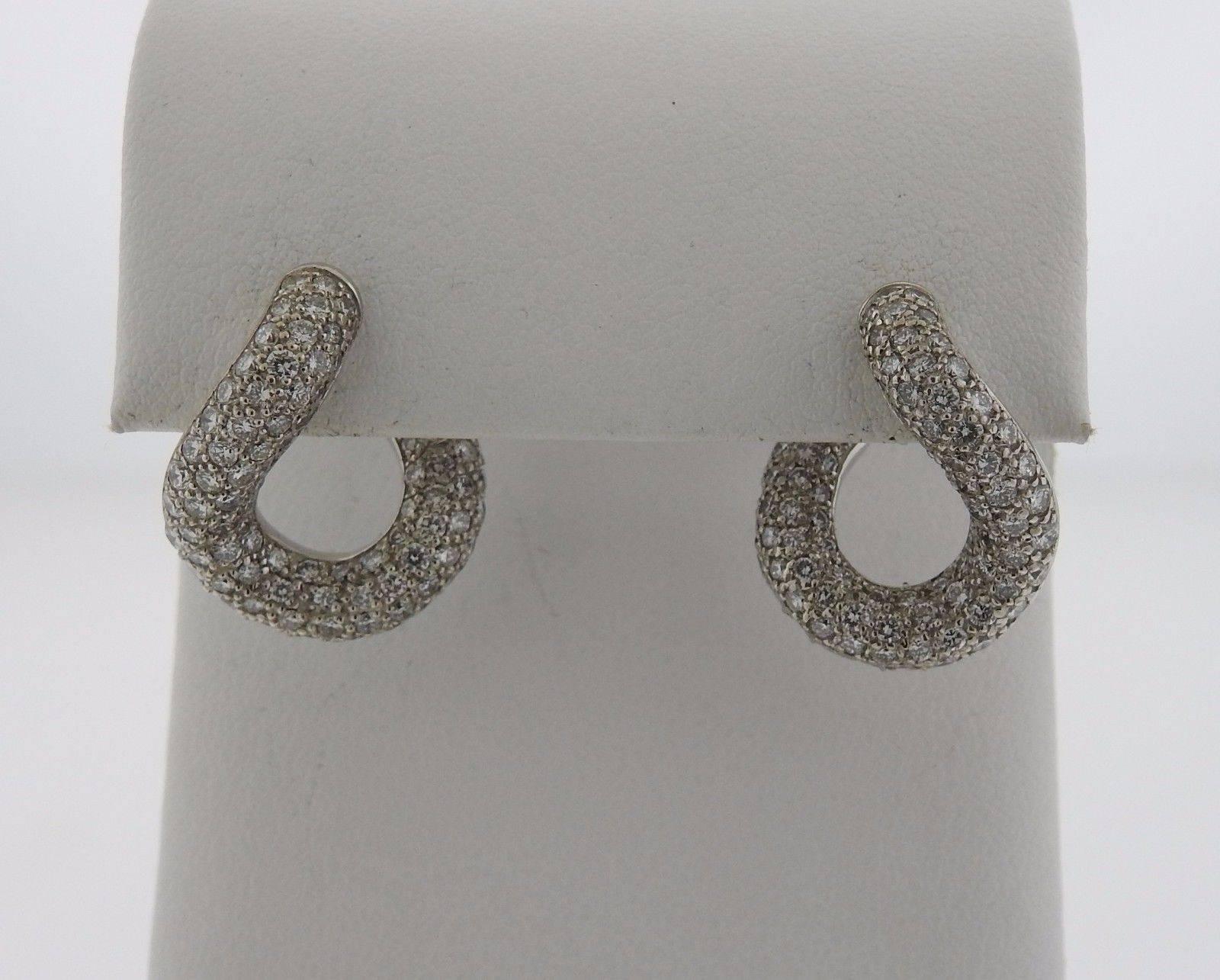 A pair of 18k white gold earrings set with approximately 2.97 ctw of G/VS diamonds.  The earrings measure 20mm x 17mm and weigh 13.6 grams. Marked: Pomellato, 750.  Current retail is $21090.