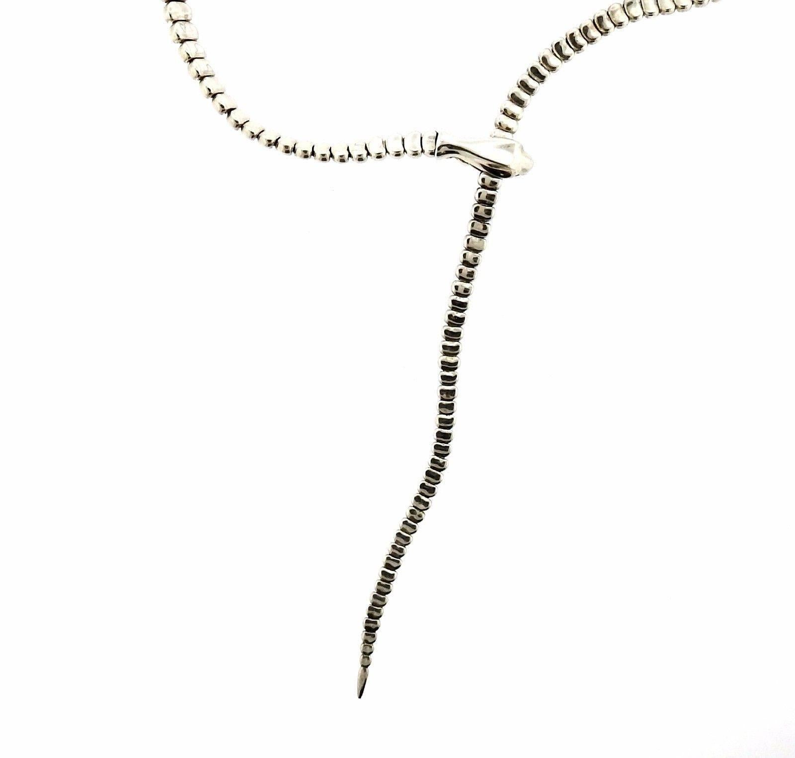 A sterling silver snake necklace by Elsa Peretti for Tiffany & Co.  The necklace length is adjustable up to 20