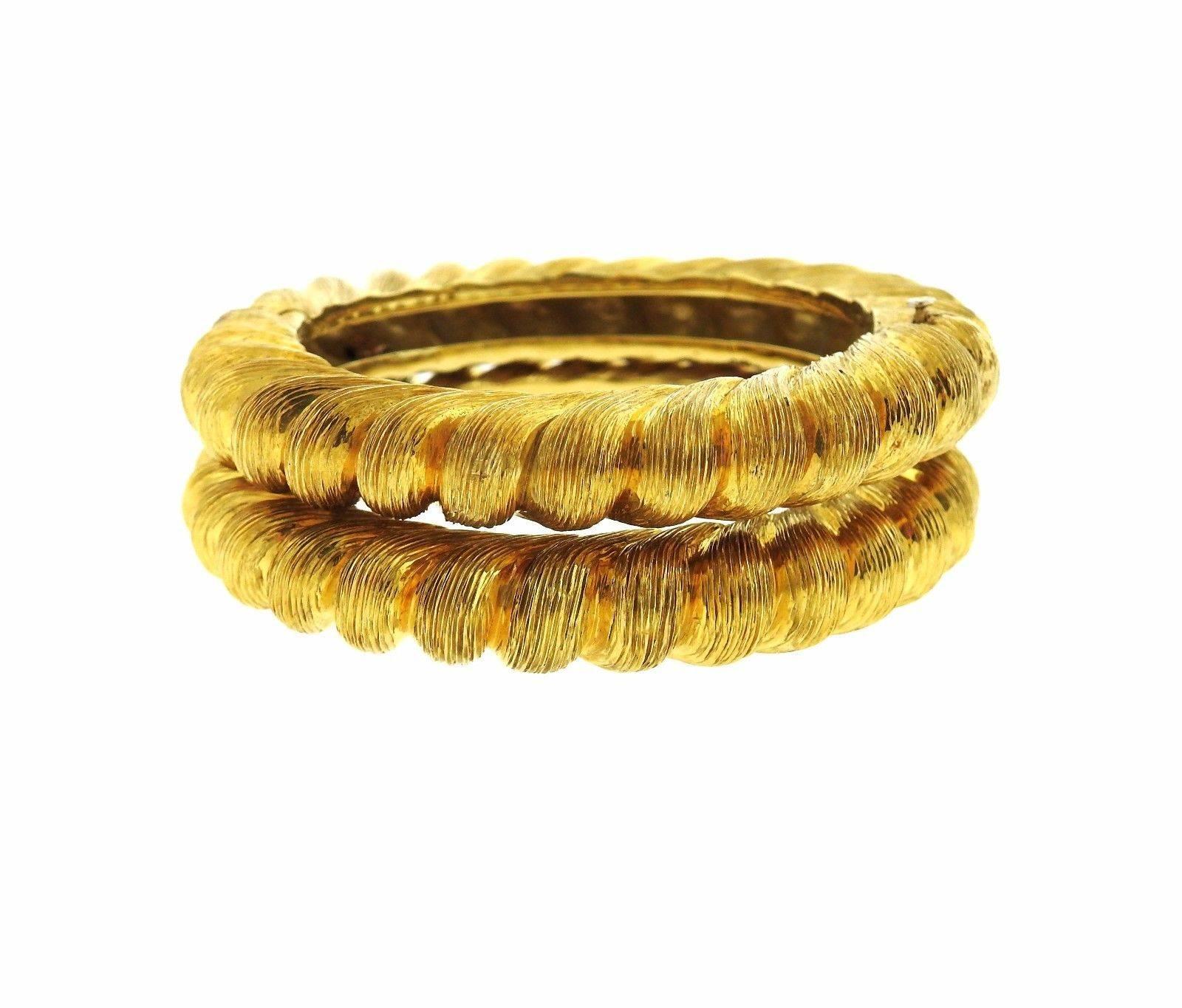 A pair of 18k yellow gold bangle bracelets by Tiffany & Co.  The bracelets will fit up to a 6 1/2