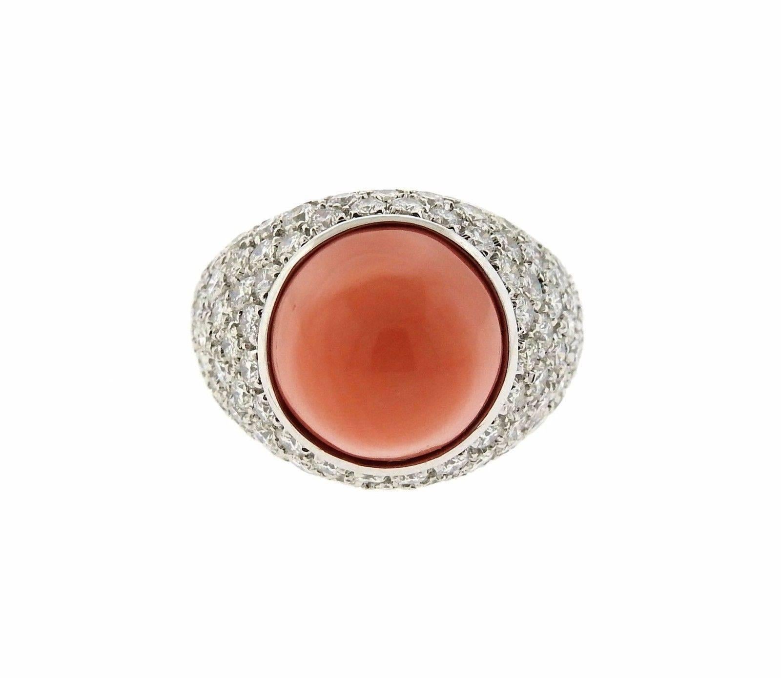 An 18k white gold ring set with a coral cabochon and 3.38ctw of F-G/VS diamonds.  The ring is a size 6 1/2 and the top sits 16.5mm from the finger. The weight of the ring is 16.9 grams.  Marked: Chantecler, 750.  Current retail is $15070.