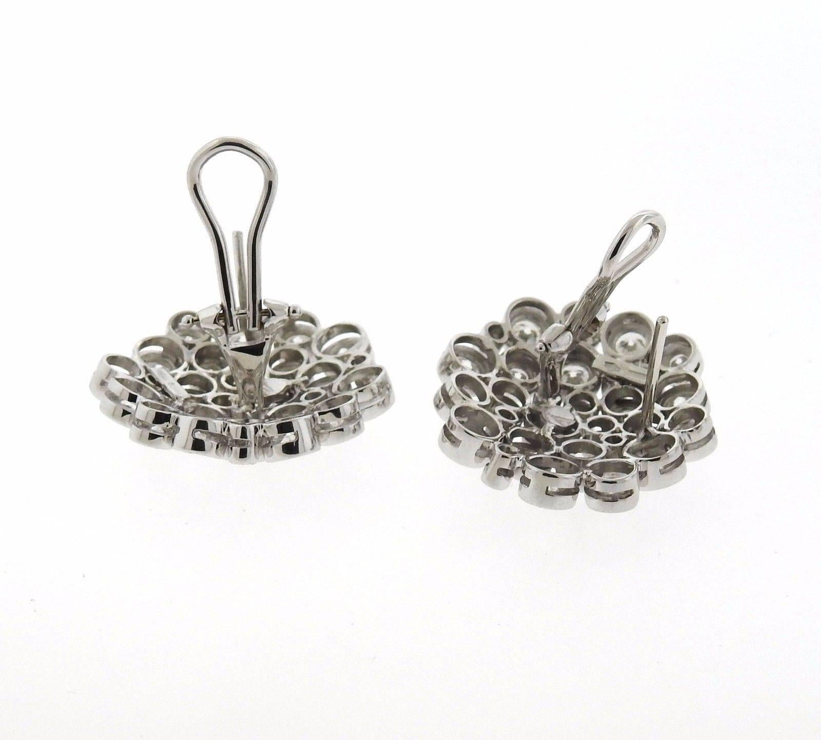 A pair of 18k white gold earrings set with approximately 5.50ctw of G/VS diamonds.  The earrings are  25mm in diameter and weigh 18.4 grams.  Marked: A, 750.