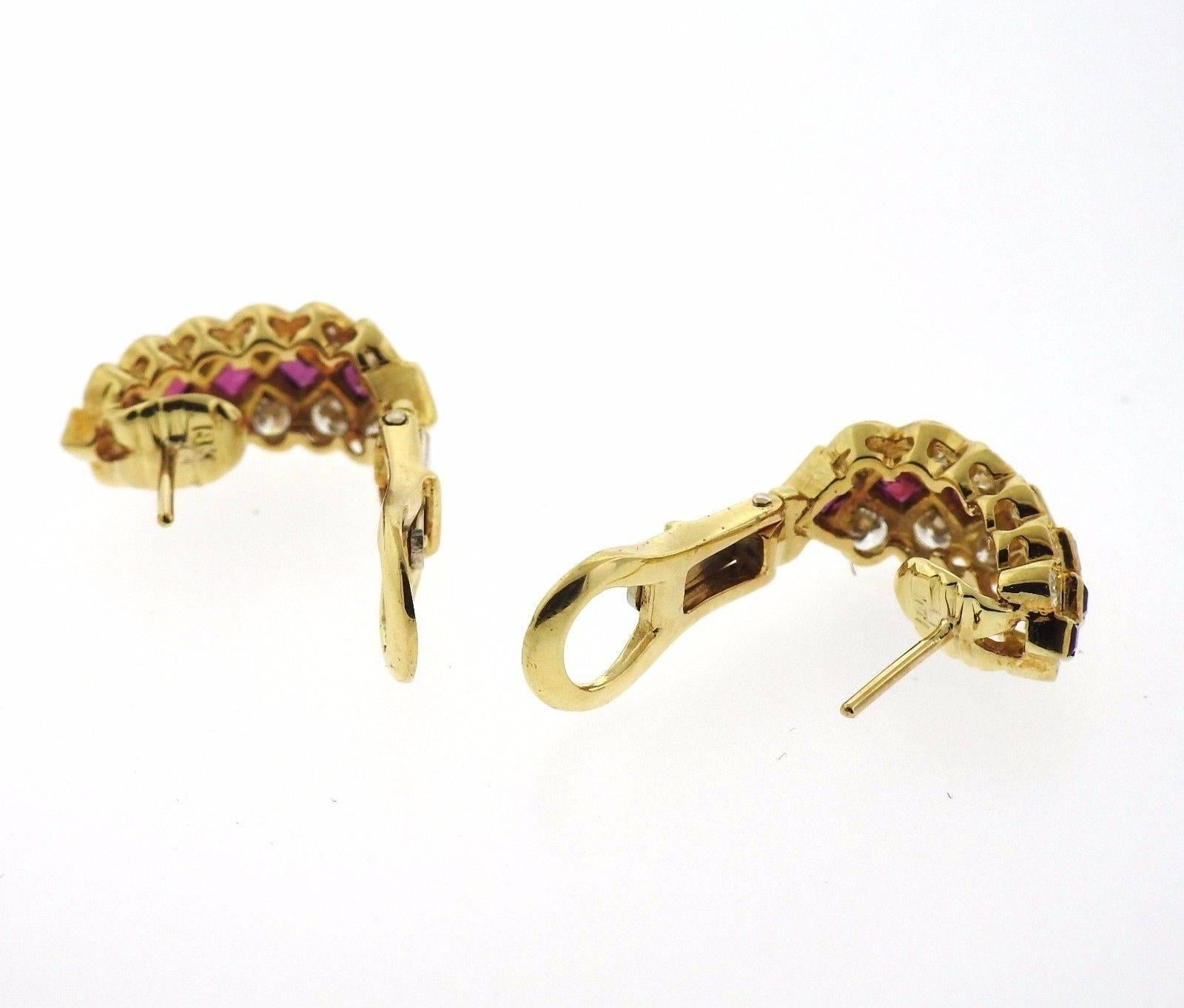 A pair of 18k yellow gold earrings set with rubies and approximately 1.20ctw  G/VS diamonds.  The earrings measure 19mm x 9mm and weigh 10.2 grams.  Marked: 18k, Tiffany.