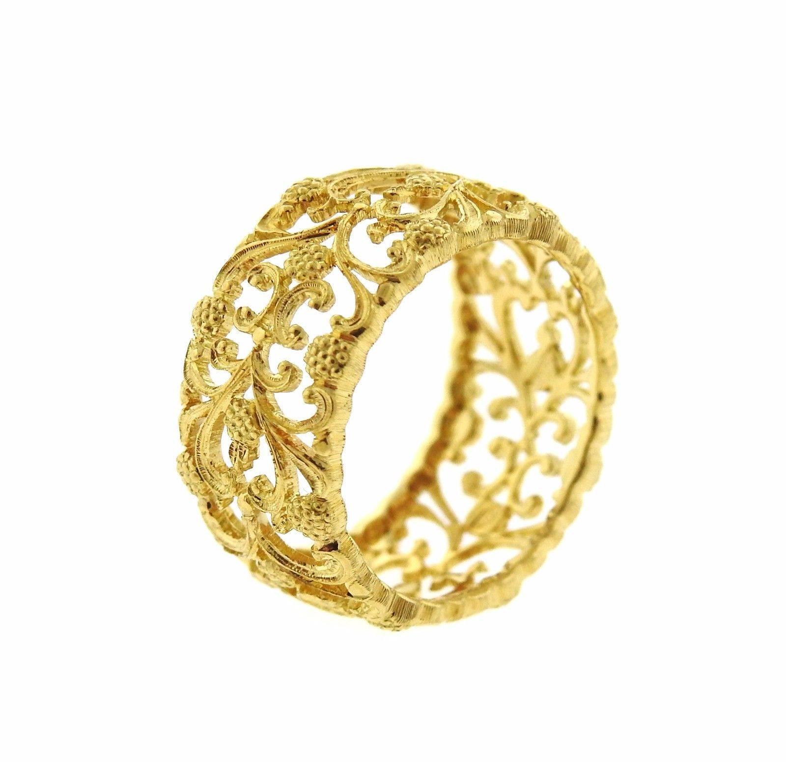 An 18k yellow gold open work wedding band ring.  The ring size 6 3/4, ring is 10mm wide.  The weight of the piece is 4.8 grams.  Marked:  Buccellati, Italy, 18k.  Retail is $7570. Comes with Buccellati paperwork. 
