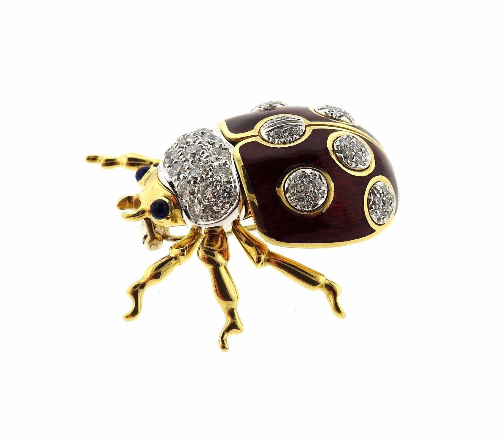 An 18k yellow gold ladybug brooch set with sapphire eyes (one with tiny chip ) and approximately 0.80ctw of G/VS diamonds.  The brooch measures 34mm x 32mm and weighs 22.5 grams. Marked: Tiffany & Co. 750