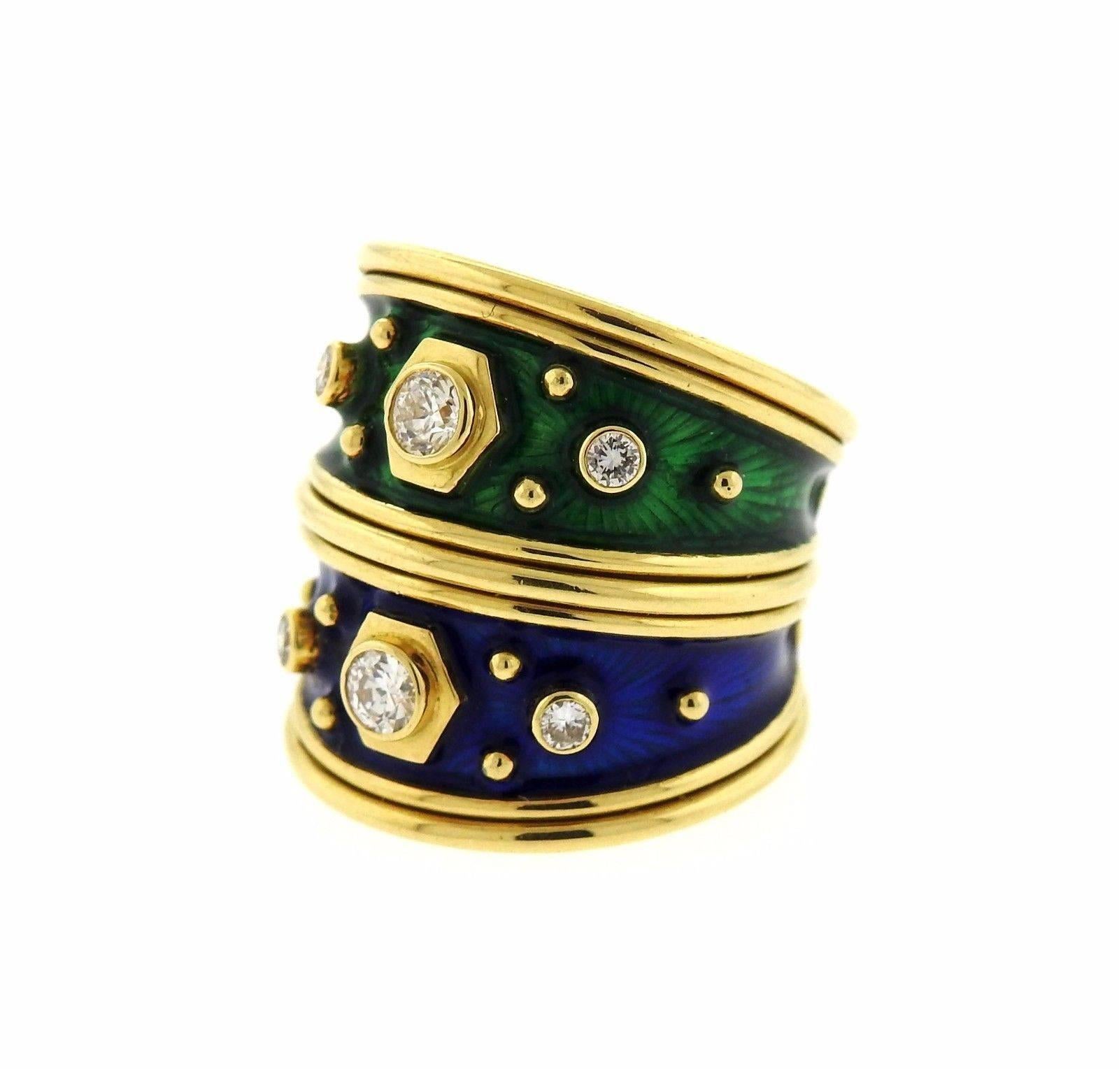 An 18k yellow gold ring adorned with enamel and set with approximately 0.42ctw of G/VS diamonds.  The ring is a size 5.5 and measures 22mm at the widest point.  The weight of the piece is 13.5 grams.  Marked: EG, Gage