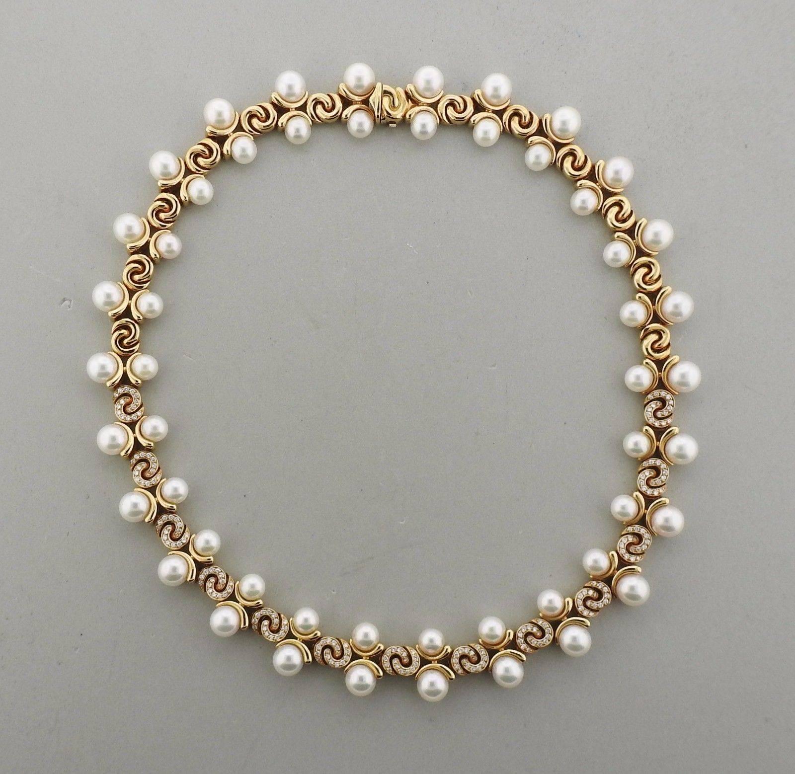 An 18K gold necklace bracelet and earrings suite by Marina B.  The set contains a total of 3.30ctw of FG-VVS-VS diamonds and 7mm-8mm pearls.  Necklace measures 16