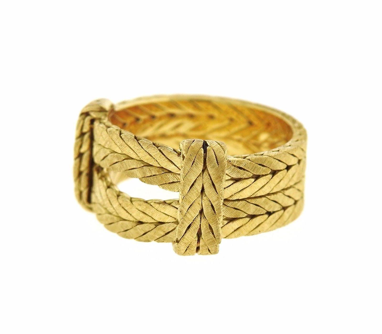 An 18k yellow gold ring by Buccellati.  The ring is a size 6 and is 10mm wide.  The weight of the ring is 8.4 grams.  Marked: Buccellati, 750, Italian mark.  Retail is $4070.