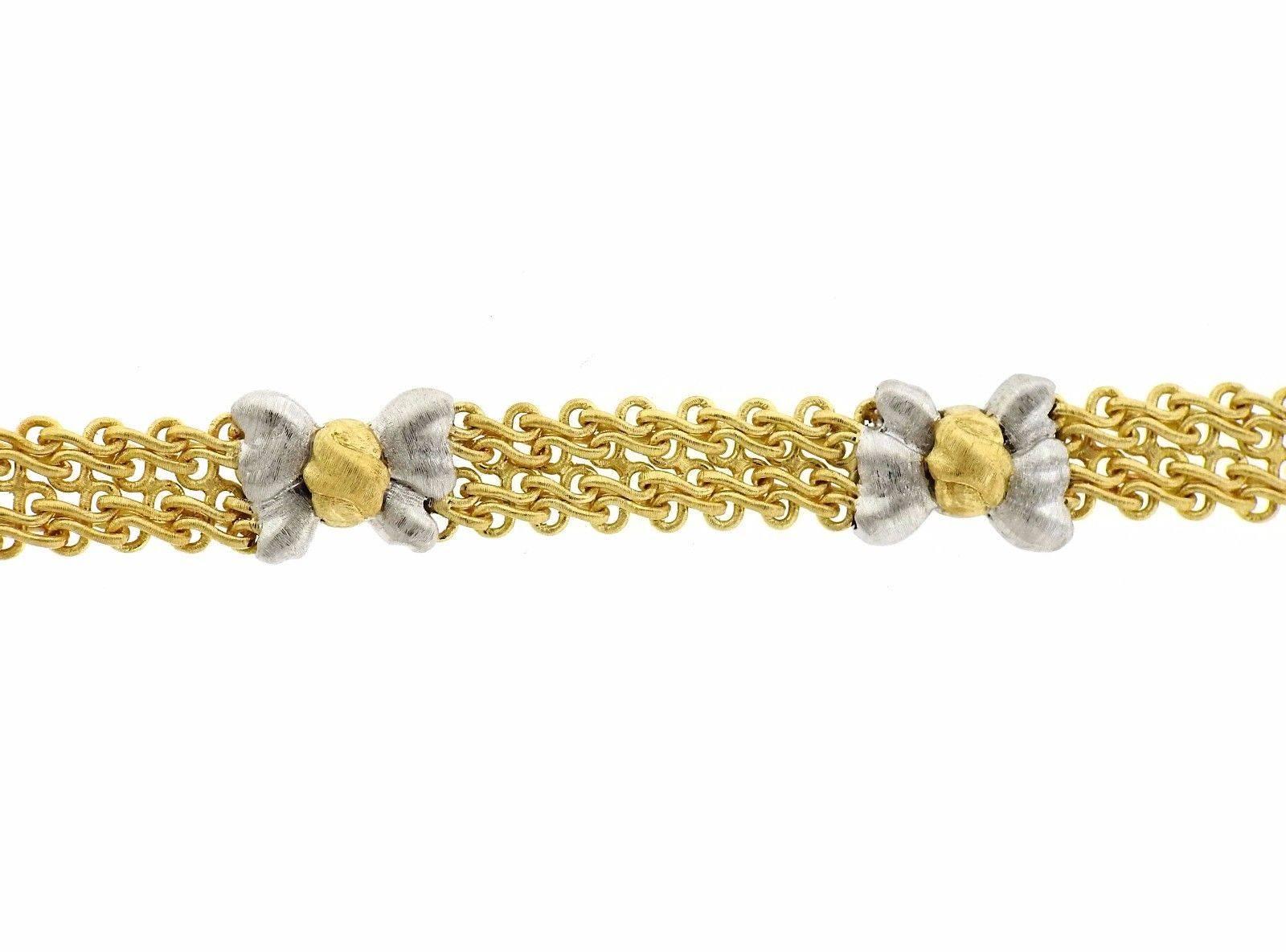 An 18k white and yellow gold bracelet by Buccellati.  The bracelet is 7