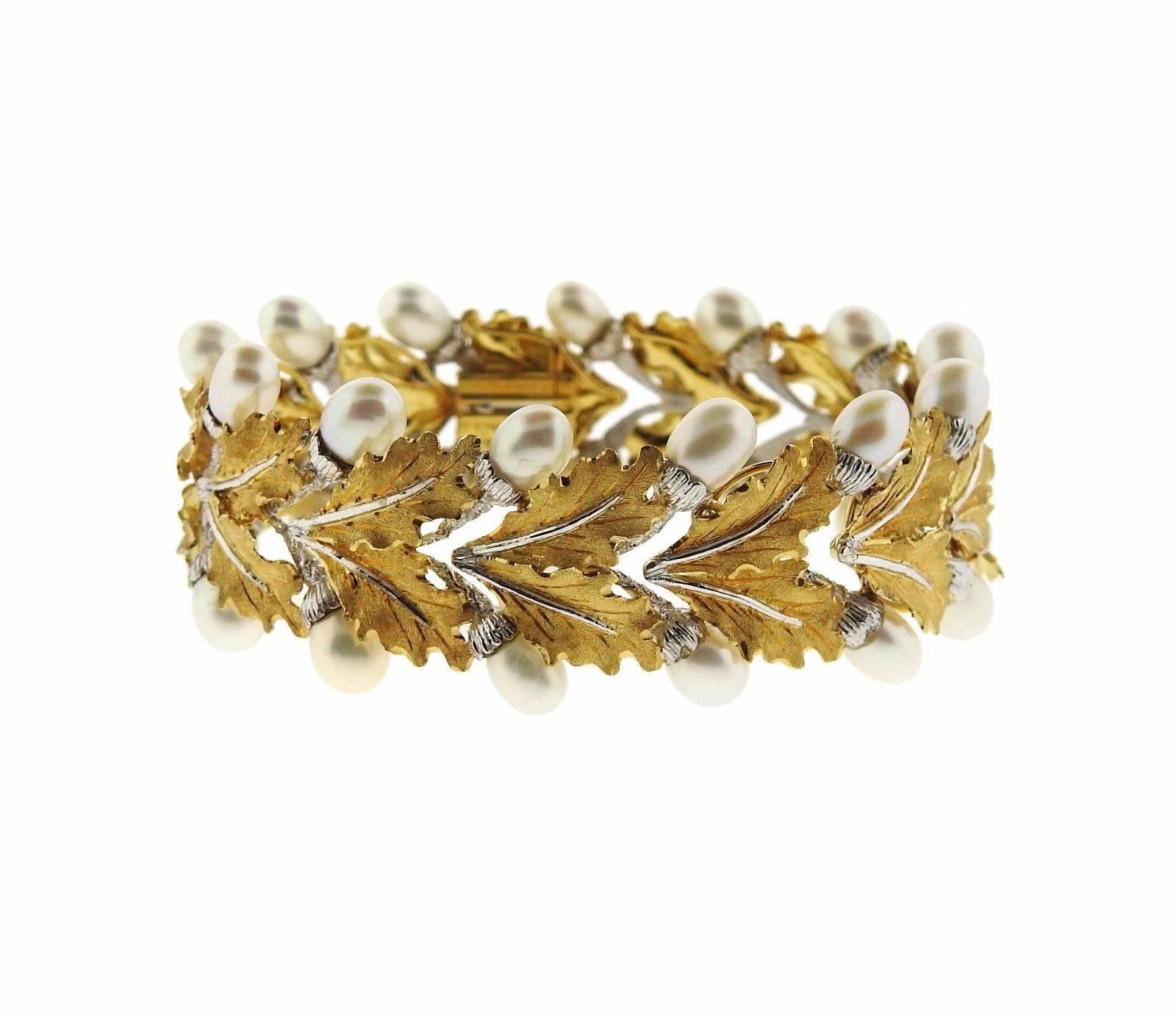 An 18k white and yellow gold bracelet set with pearls.  The bracelet is 7