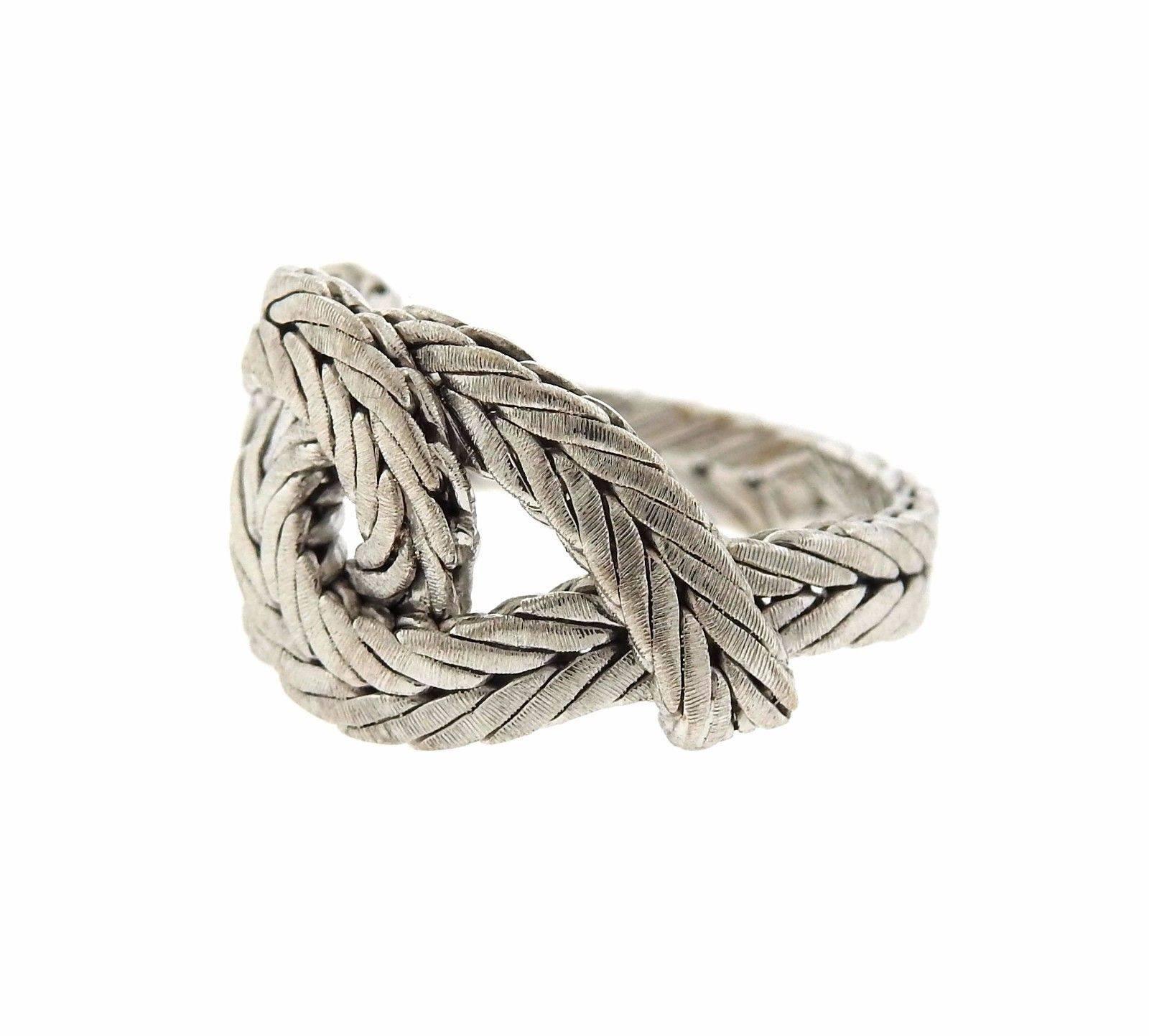 An 18k white gold braided ring by Buccellati.  The ring is a size 6, top is 13mm wide.  The weight of the ring is 7.7 grams. Marked: Buccellati, 750, Italian mark Current retail is $3590.
