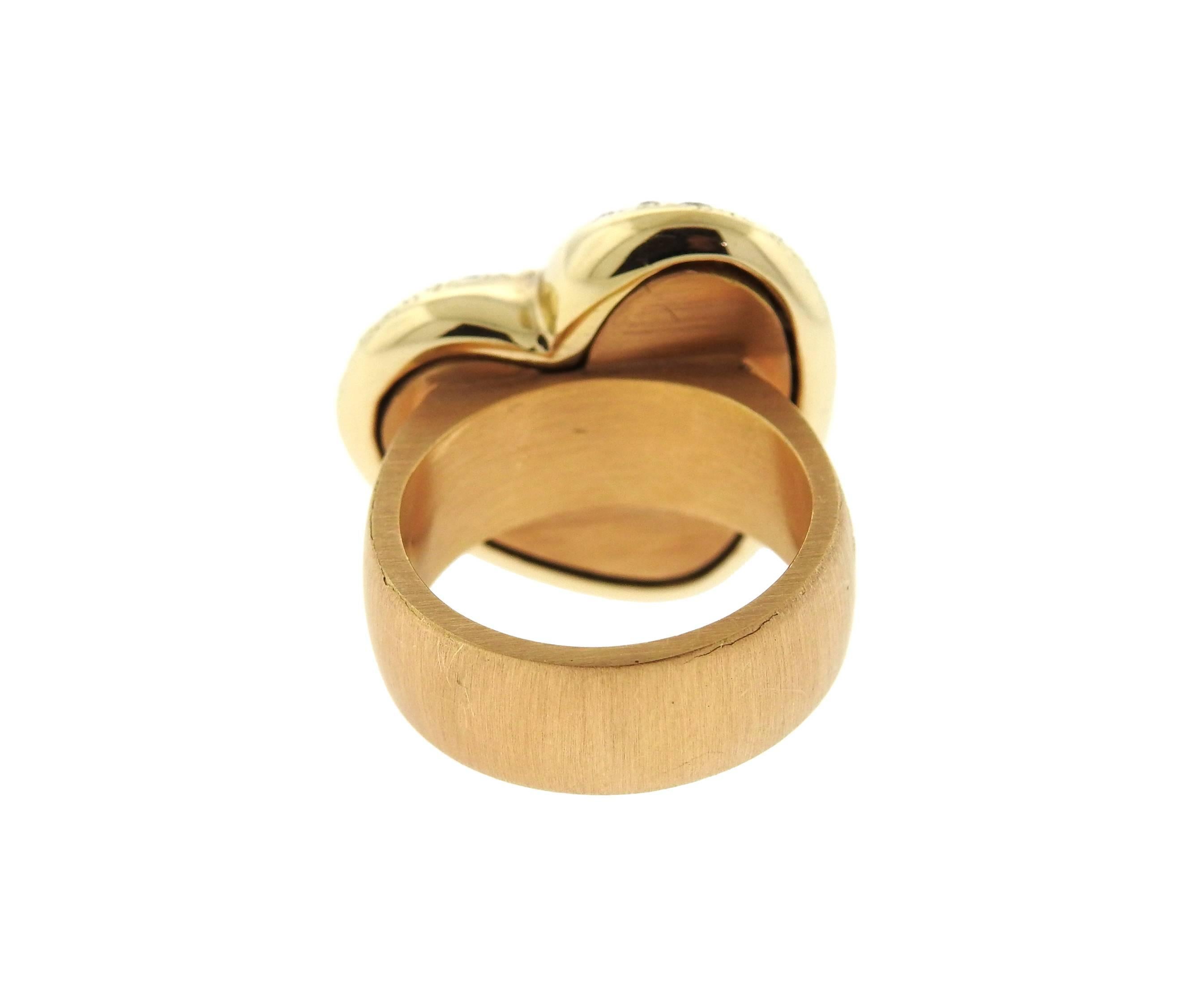 An 18k gold ring crafted by Pomellato for the Sabbia collection. Featuring 2.44ctw in fancy diamonds. Ring is a size 6 or 52. Top of ring is 21.4mm x 20.6mm. Marked Pomellato,750, Italian Assay Marks and weighs 24.7 grams. Retails for $10150