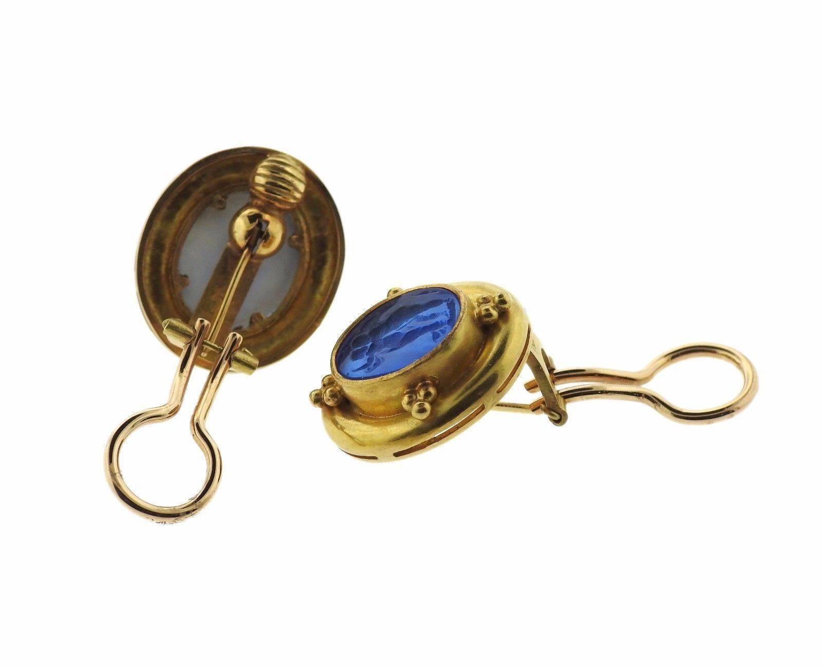 A pair of 18k yellow gold earrings, crafted by Elizabeth Locke, featuring collapsible posts. Earrings are decorated with blue Venetian glass intaglio, backed with mother of pearl. Earrings measure 22mm x 20mm. Marked: 18k , Locke mark. Weight - 16.9