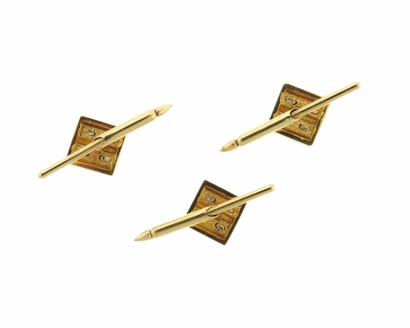 Pair of 18k two color gold cufflinks and studs. Cufflink top measures 16mm x 14mm,  stud top measures 9mm x 10mm . Weight: 31.2 grams 