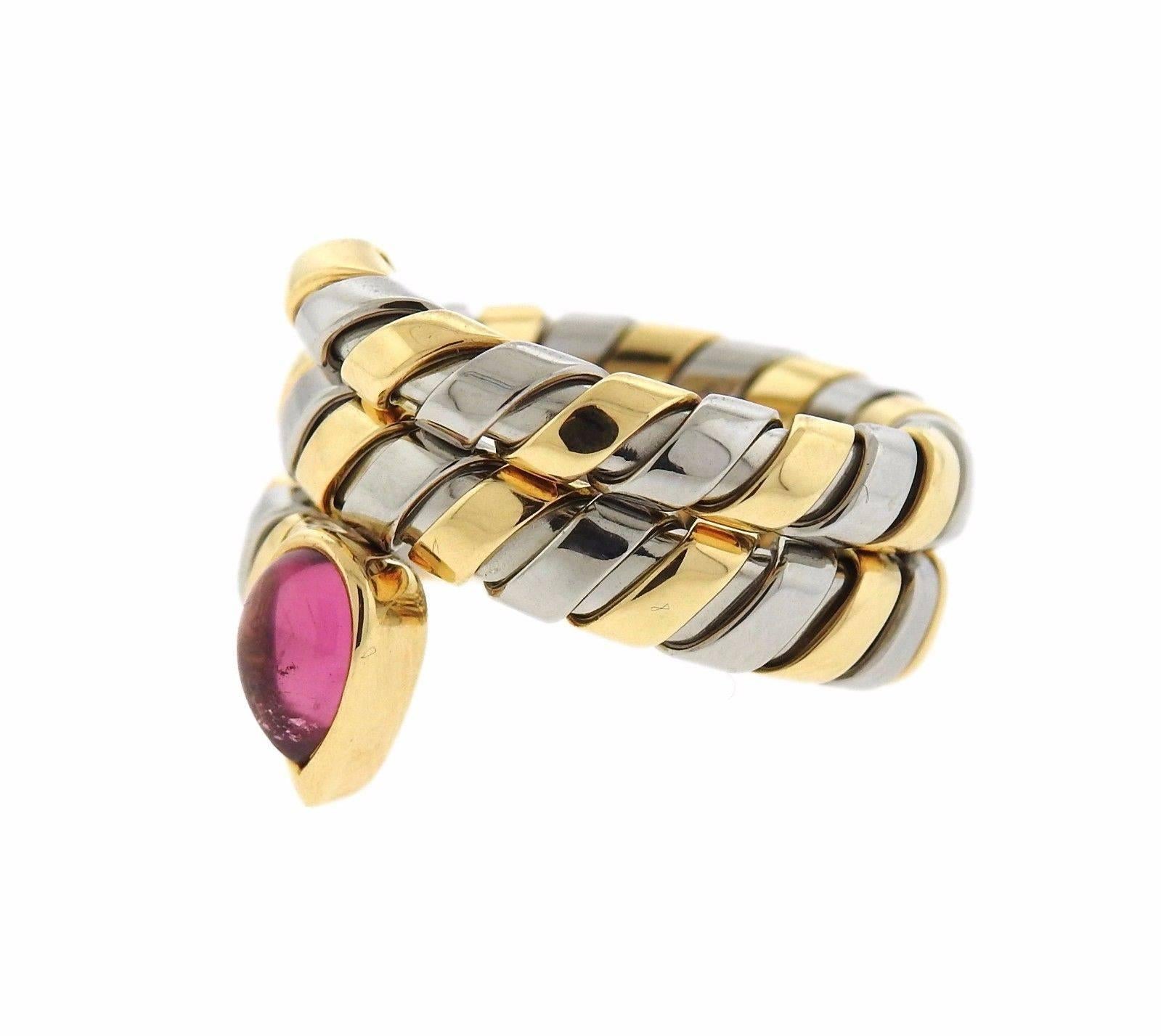 An 18k yellow gold ring set with a pink tourmaline.  The ring is a size 6 (slightly flexible) and 17mm wide.  The weight of the piece is 10 grams. Marked: Bvlgari, 750, 2337AL