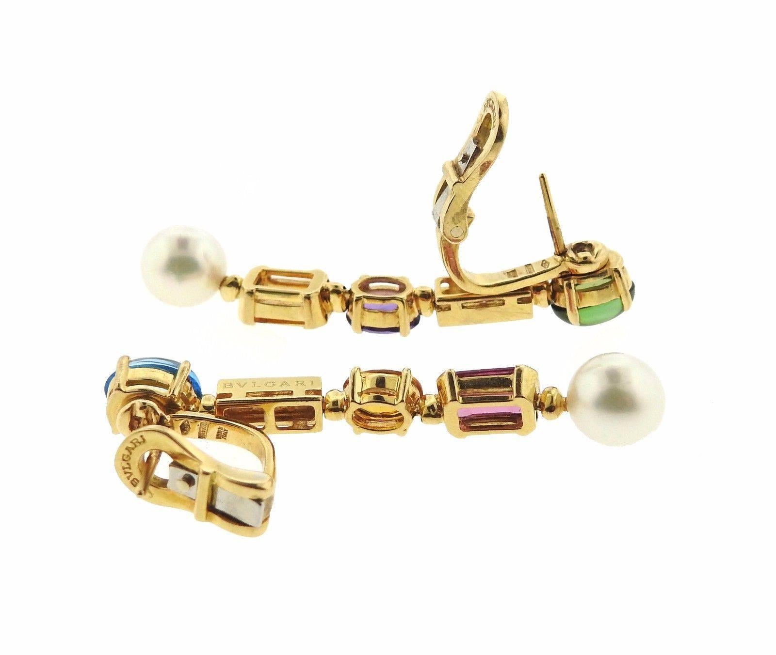 A pair of colorful 18k yellow gold drop earrings, crafted by Bulgari for Allegra collection, set with pearls, diamonds, amethyst, citrine, topaz, peridot and pink tourmaline gemstones. Earrings are 46mm long. Marked: Bvlgari, 750, made in Italy.