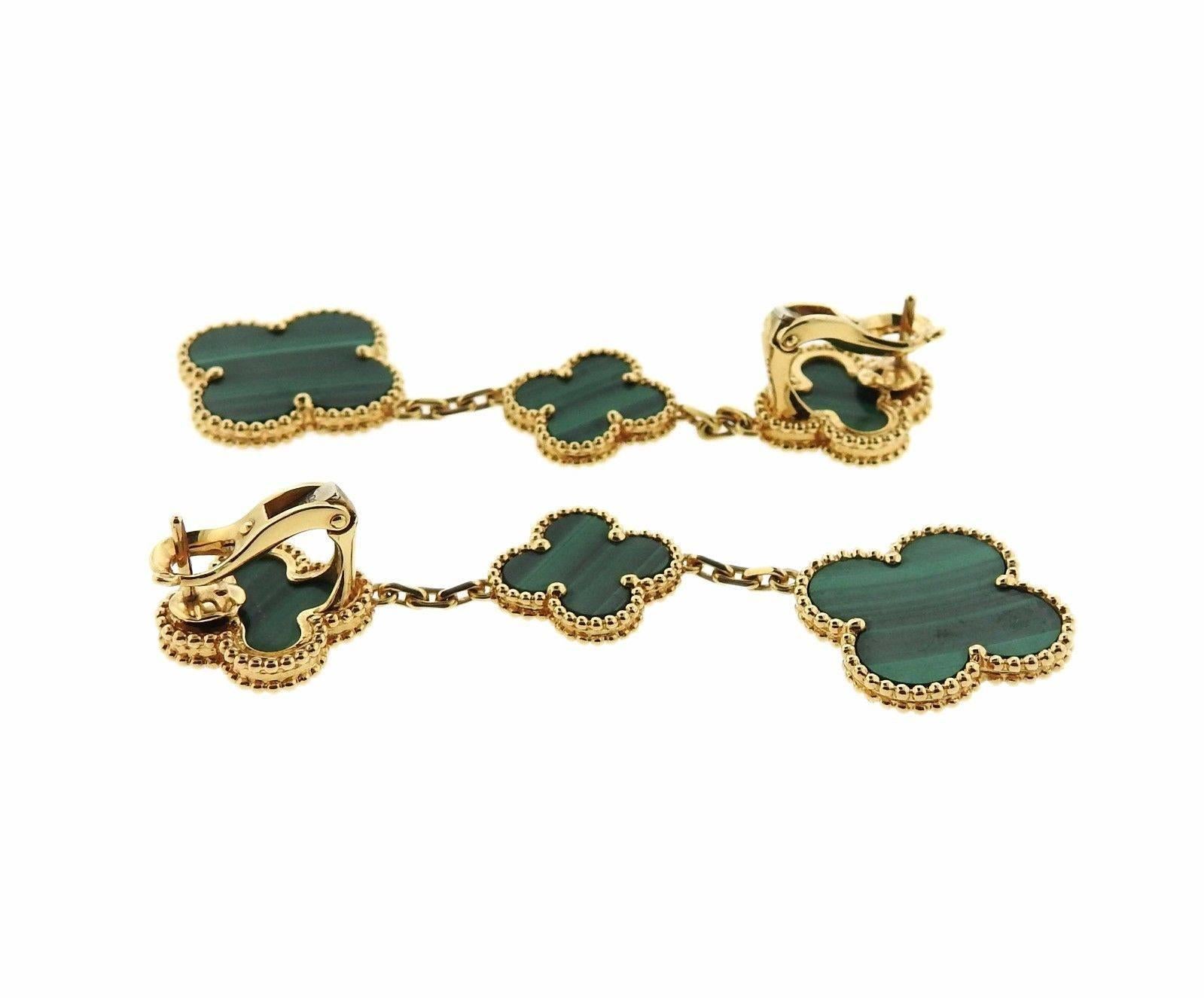 A pair of beautiful three motif drop earrings, crafted by Van Cleef & Arpels for iconic Magic Alhambra collection, with malachite stones.  Earrings are 68mm long x 20mm wide. Marked: VCA, au750, JB167933. Weight: 19.5 grams
Retail $9350, come with