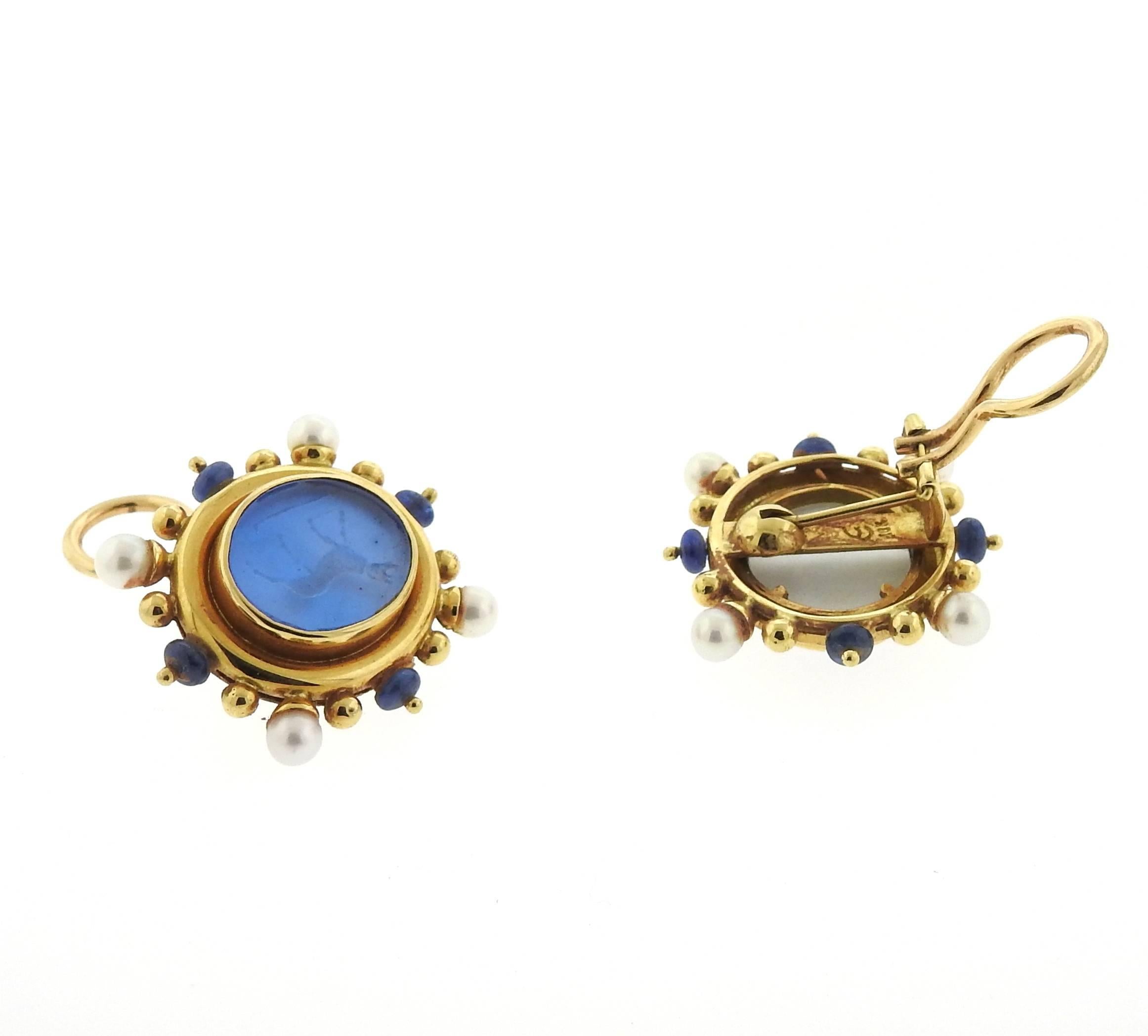 A pair of 18k yellow gold earrings, crafted by Elizabeth Locke, decorated with Venetian glass intaglio, backed with mother of pearl, surrounded with blue sapphires and pearls. Earrings are 26mm x 29mm, collapsible posts. Marked: Locke hallmark, 18k.