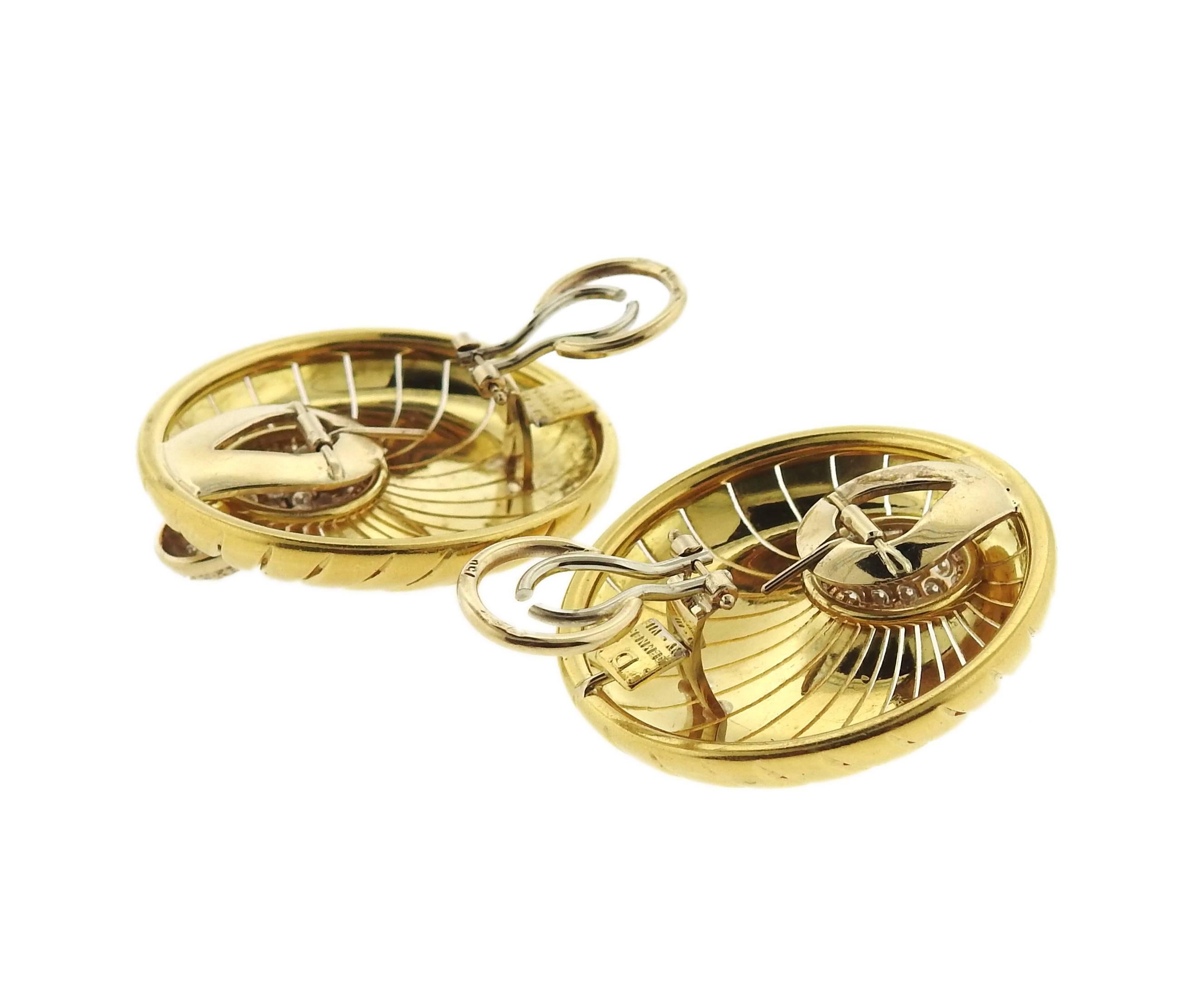 A pair of large 18k gold disc earrings, crafted by Demner, set  with approximately 1.10ctw in diamonds. Earrings measure 35mmin diameter, feature collapsible posts. Marked: Demner, D, Ny-VIE. Weight - 39.2 grams 
