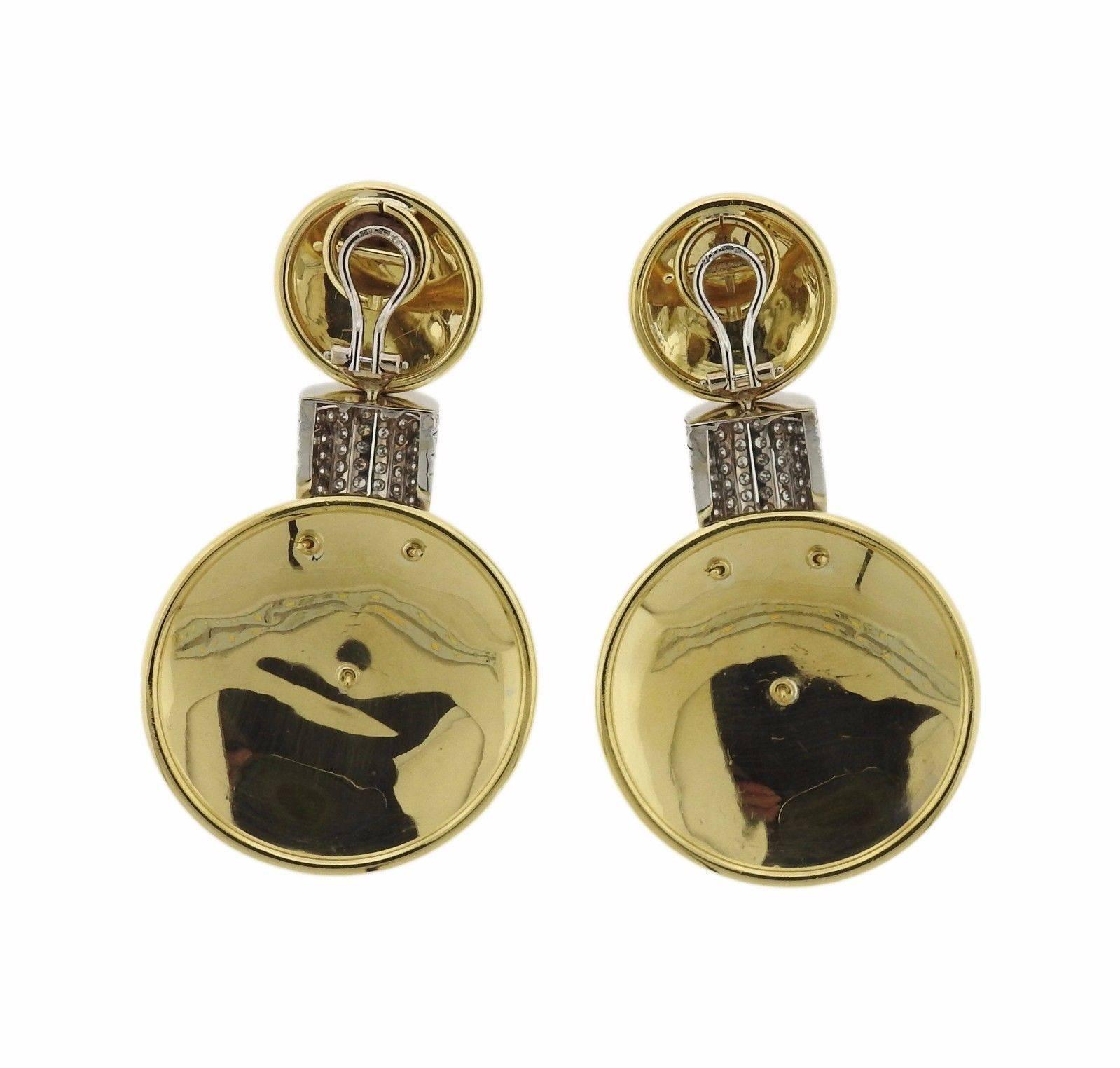 A pair of 18k yellow gold earrings set with approximately 2 carats of GH/VS diamonds.  The earrings are 69mm long x 38mm in diameter of bottom discs.  The weight of the pair is 39.1 grams.