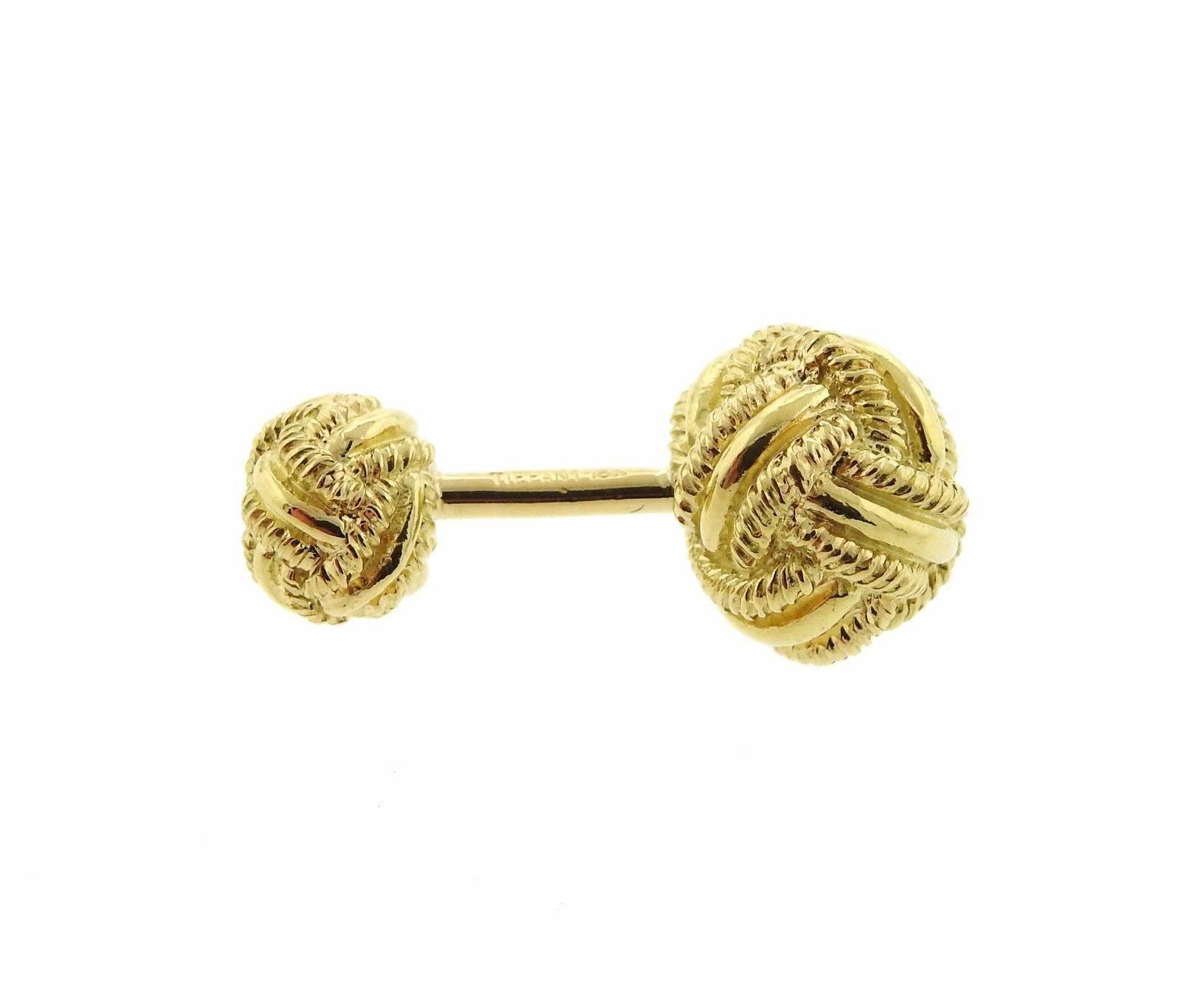A pair of 18k yellow gold cufflinks by Tiffany & Co.  The cufflink tops measure 13.2mm in diameter.  The weight of the pair is 18.3 grams.  