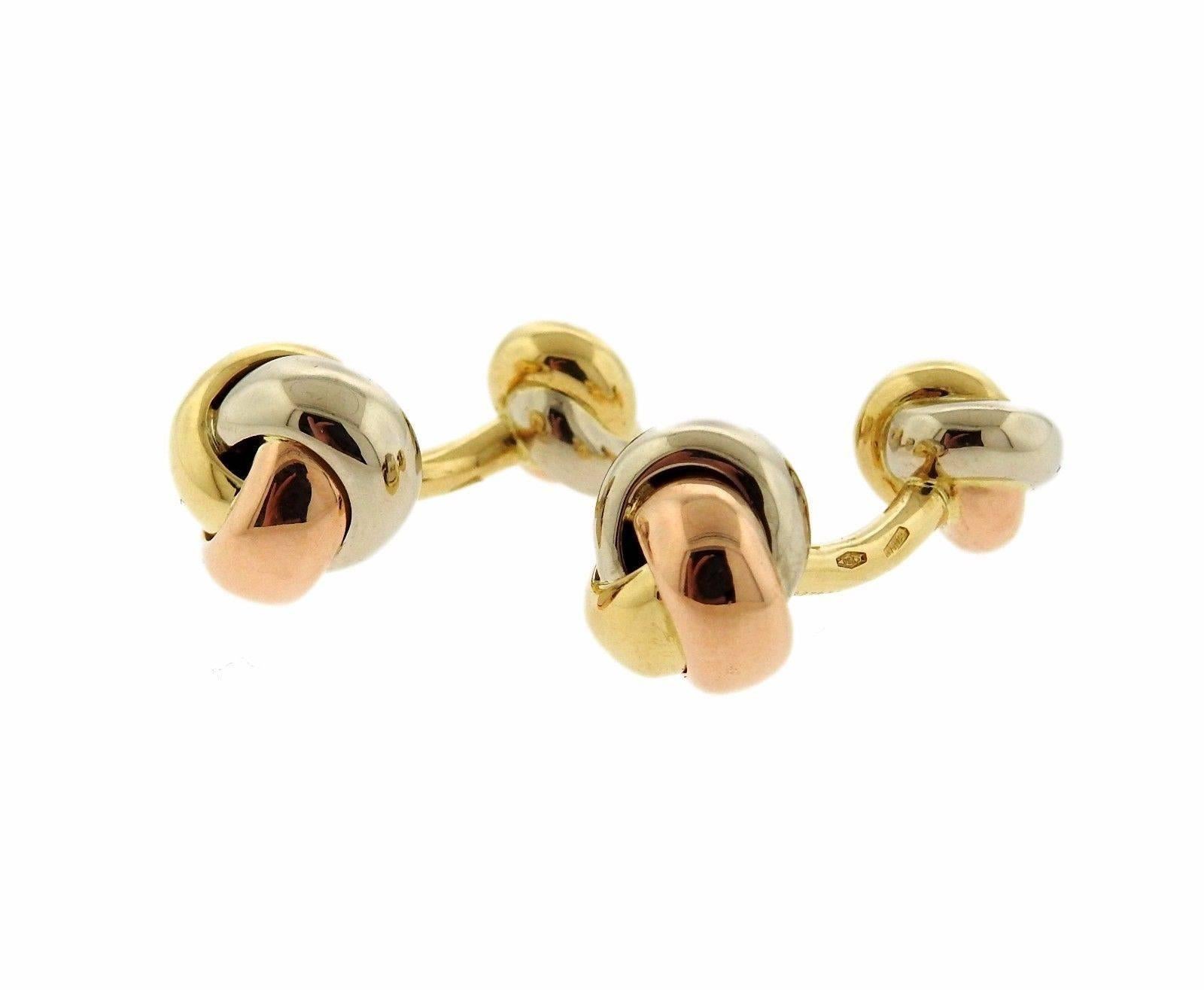 A pair of 18k white yellow and rose gold cufflinks by Cartier.  The cufflink tops measure 13.5mm in diameter.  The weight of the set is 19.3 grams. Marked: Cartier, 750, French Marks. Comes with Cartier Box.
