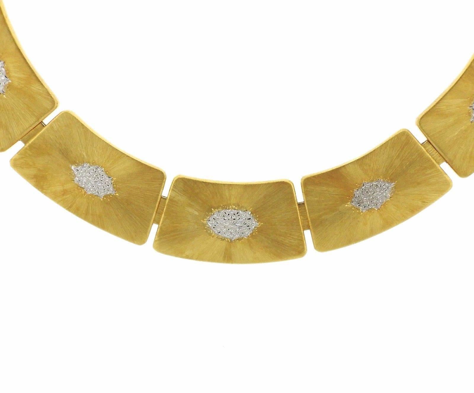 An 18k yellow and white gold necklace. Necklace measures 14