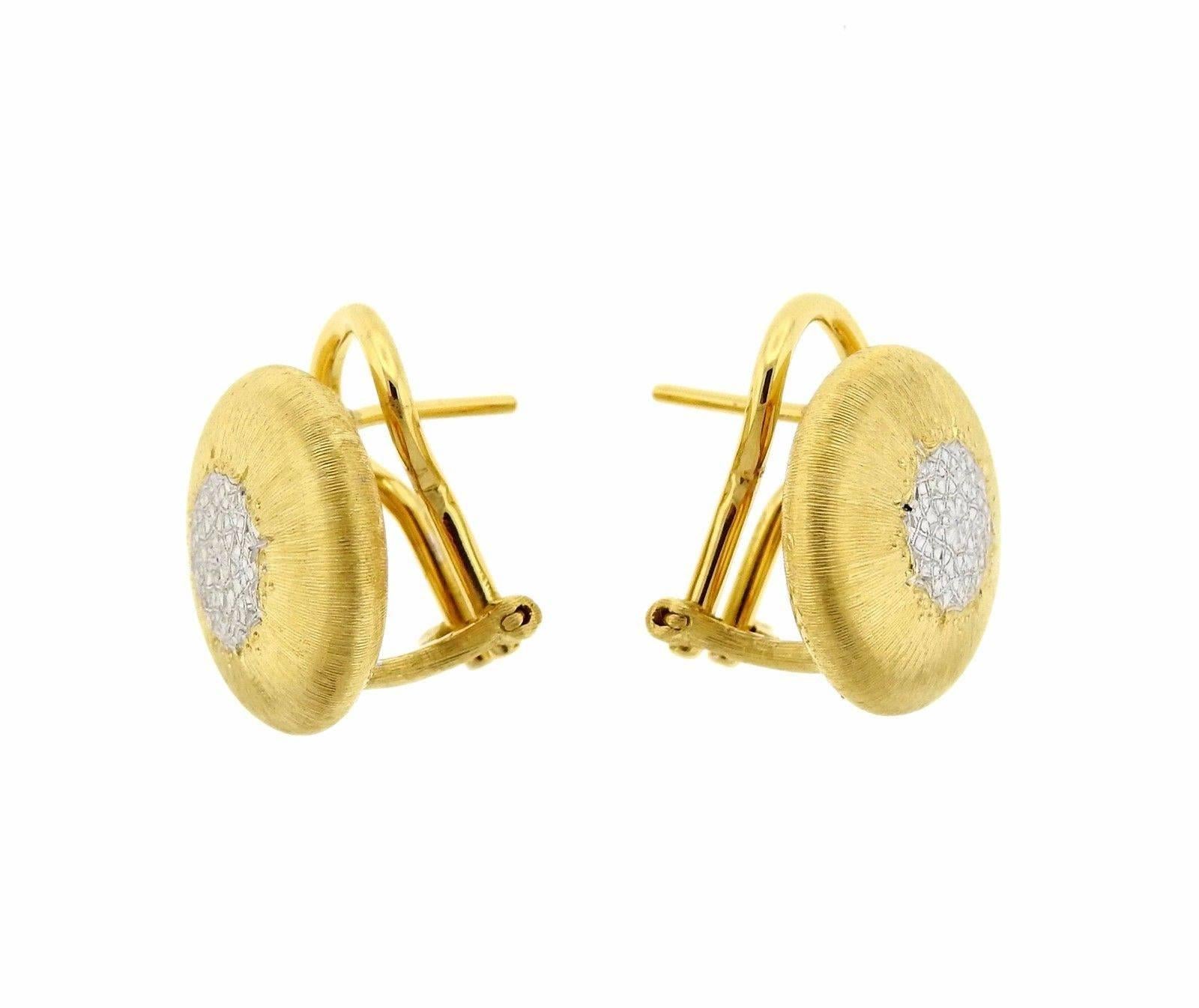 A pair of 18k yellow and white gold button earrings by Buccellati. Earrings measure 14.5mm in diameter and weigh 8.25 grams.  Marked: 18k, Italy, Buccellati. Retail current is $3640.