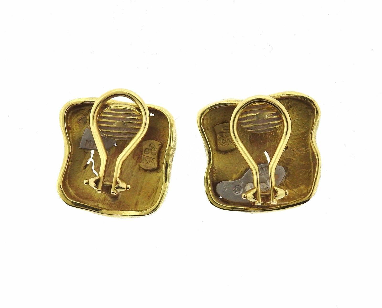 A pair of 18k gold earrings set with G/VS diamonds.  The earrings measure 18mm x 16mm and weigh 16.4 grams.SG, Plat, 18k