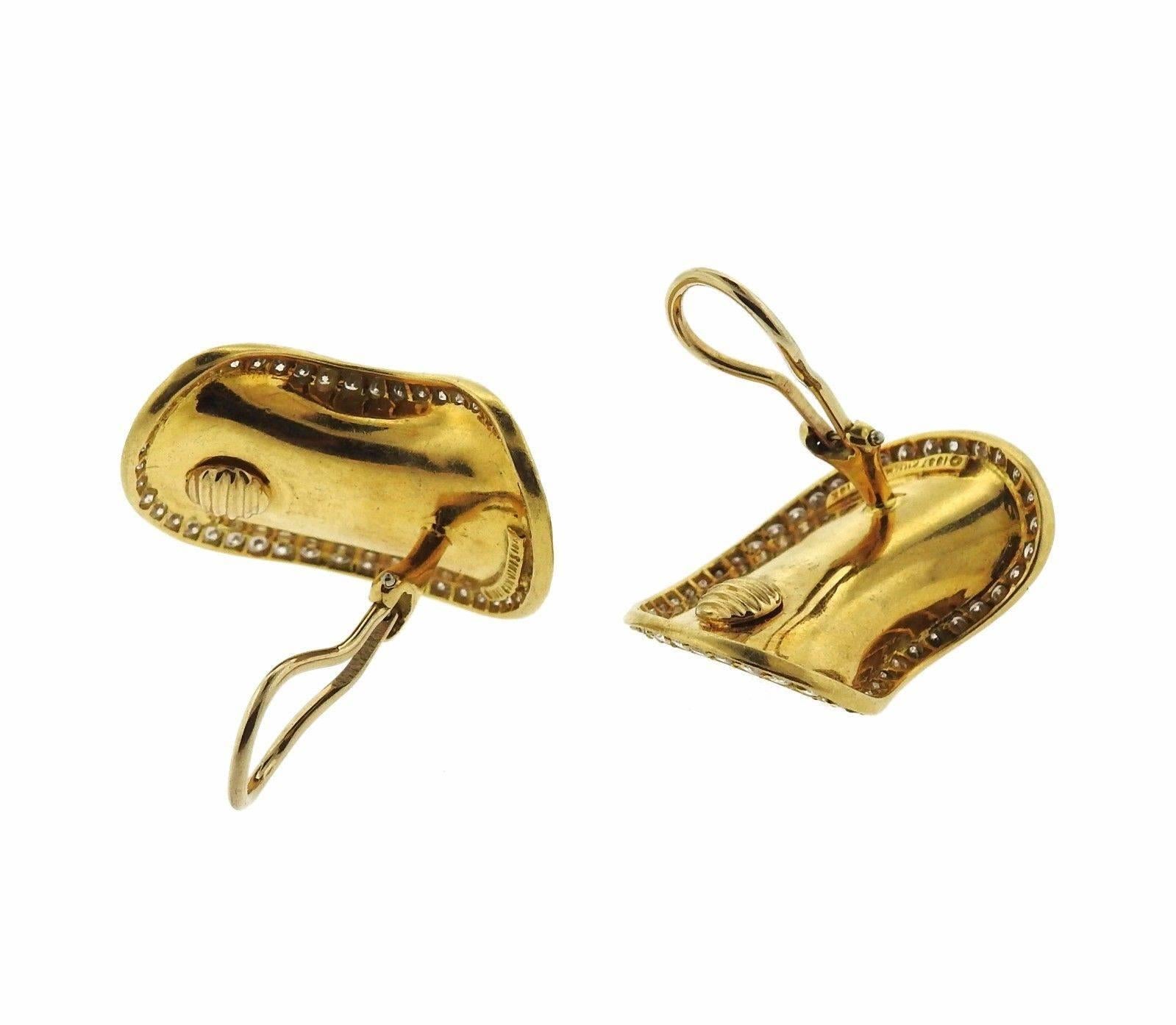 A pair of 18k yellow gold earrings set with one carat of G/VS diamonds. Earrings measure 30mm x 25mm and weigh 20.9 grams.  Marked with Makers marks, 18k, 1987