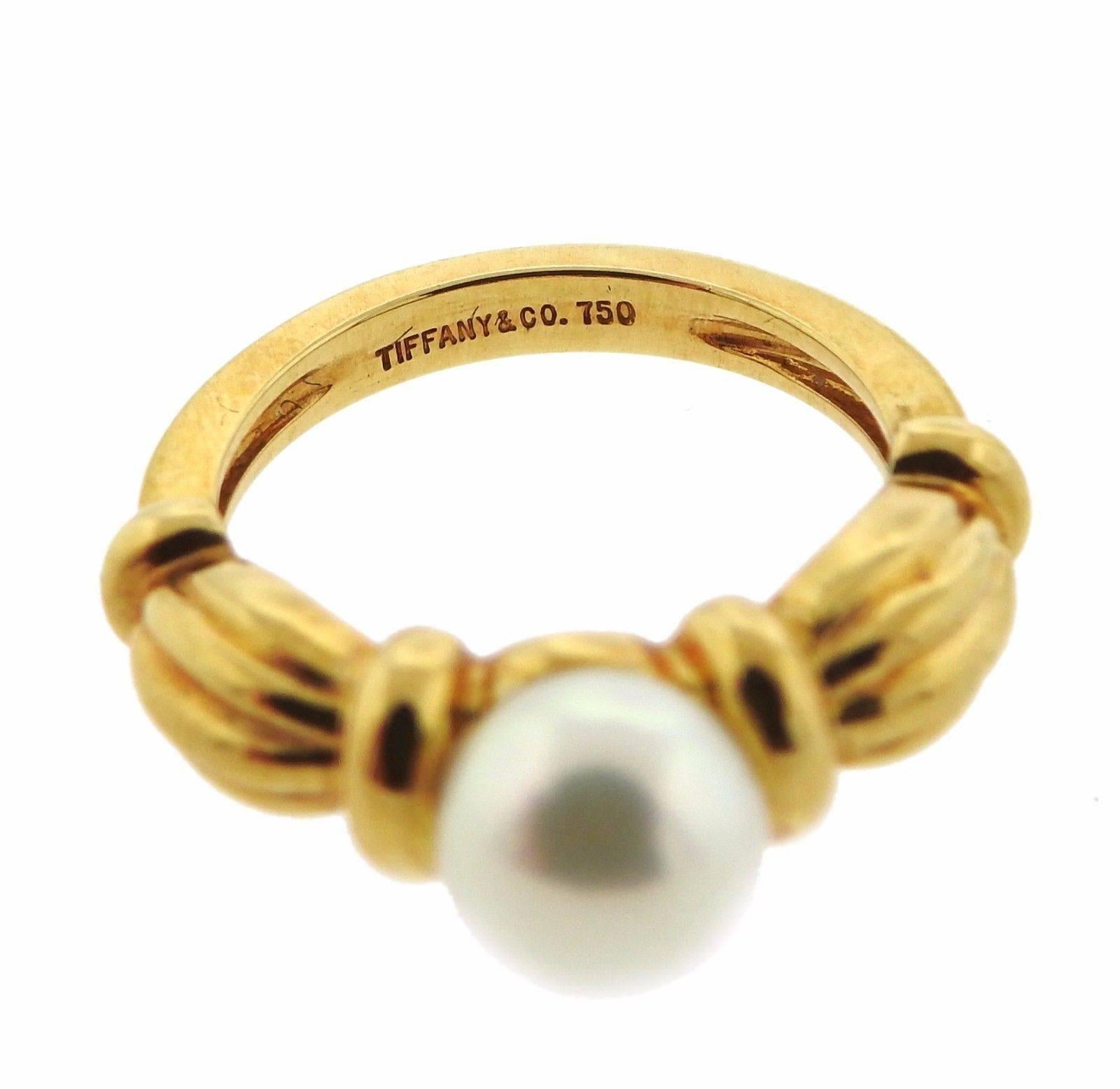 An 18k yellow gold ring set with a 7.3mm pearl.  The ring is a size 4.5 and weighs 5.9 grams.  Marked: Tiffany & Co. 750.