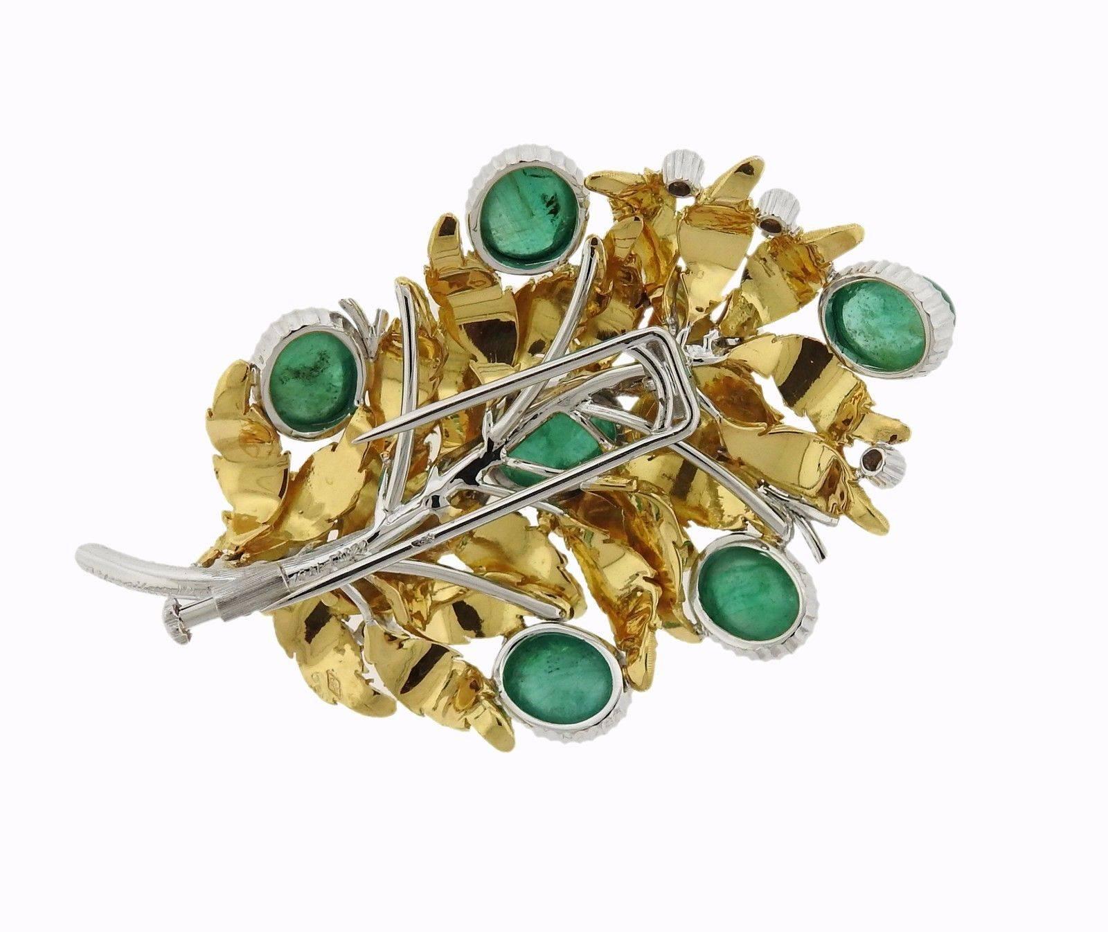 An 18k gold leaf motif brooch set with 8.87ctw of emeralds and approximately 0.50ctw of GH/VS diamonds.  The brooch measures 58mm x 38mm and weighs 27.9 grams. Marked: 18k, Italy, Buccellati.  Comes with Buccellati box and paperwork.  Retail is