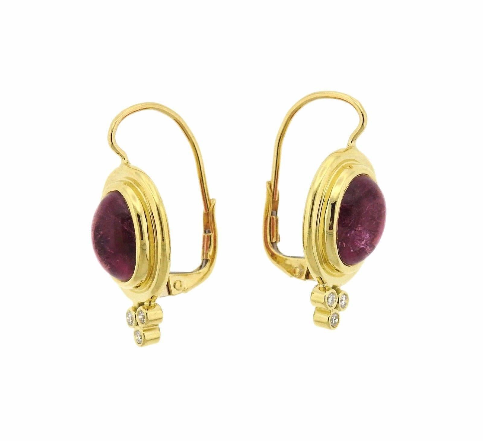 A pair of 18k yellow gold earrings set with pink tourmaline cabochons as well as 0.09ctw of G/VS diamonds.  The earrings measure 23mm long including wire x 12mm wide.  The weight of the pair is 6.8 grams.  Marked: Temple mark, 750.  Retail is $3300.