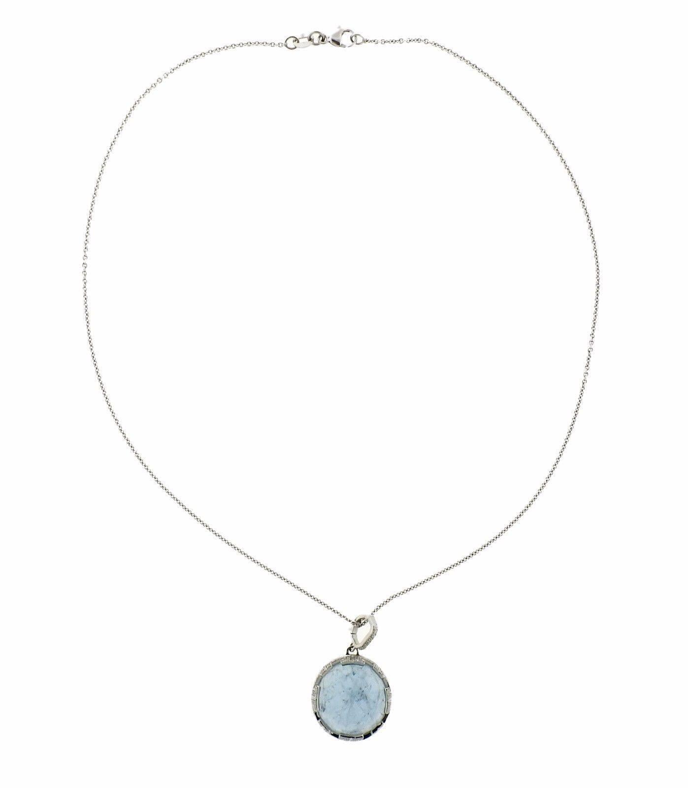 An 18k white gold necklace set with aquamarine and approximately 0.36ctw of G/VS diamonds.  The necklace is 16" long, pendant measures 18mm in diameter.  The weight of the piece is 9.9 grams. Marked: Ivanka Trump,18k, italy.  Retail for this