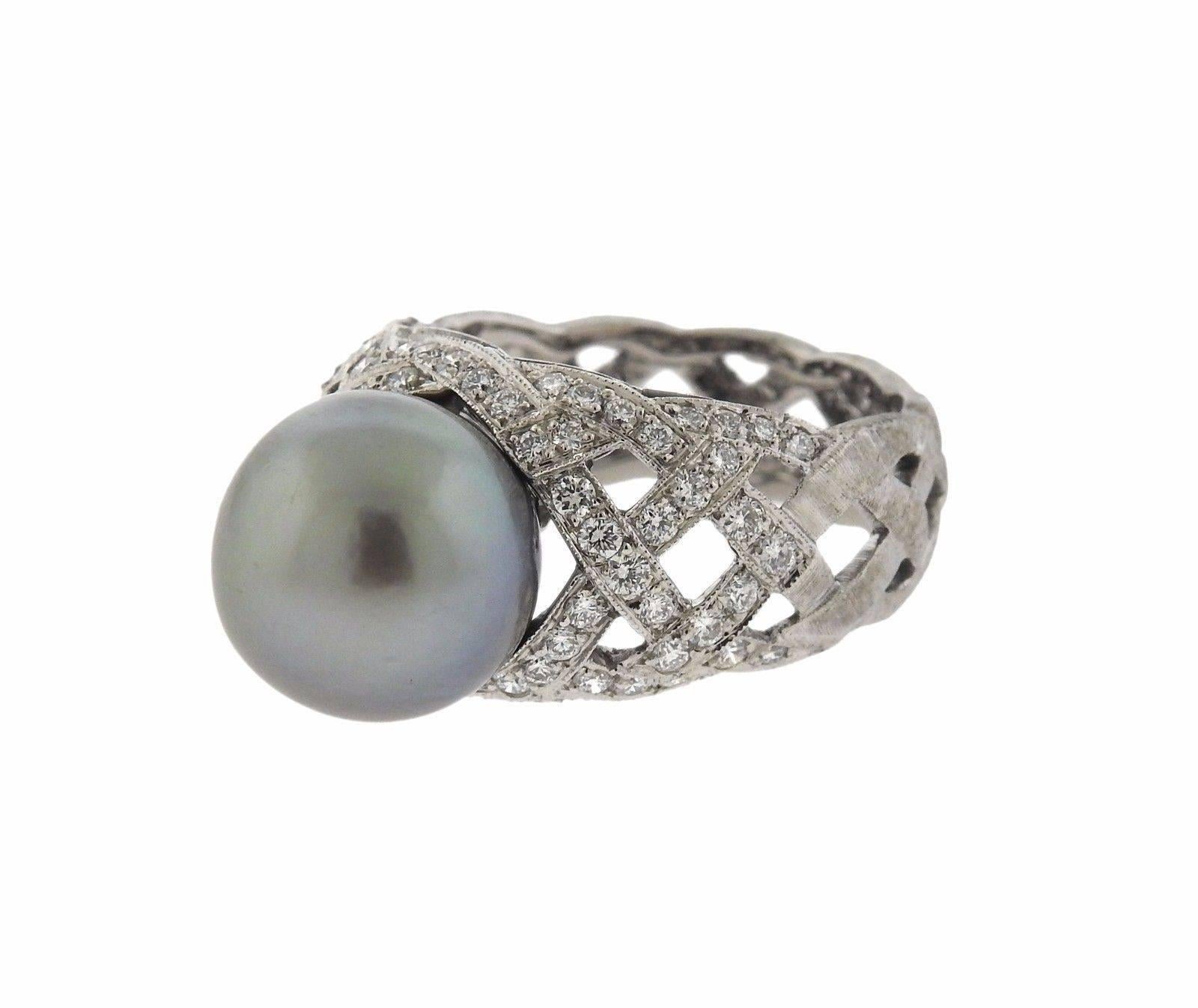 An 18k white gold ring set with a 12mm pearl and approximately 0.68ctw of GH/VS diamonds.  The ring is a size 7 3/4.  The weight of the piece is 11.1 grams.  Marked: 18K, Italy,  750, Buccellati.  The current retail is $16080.