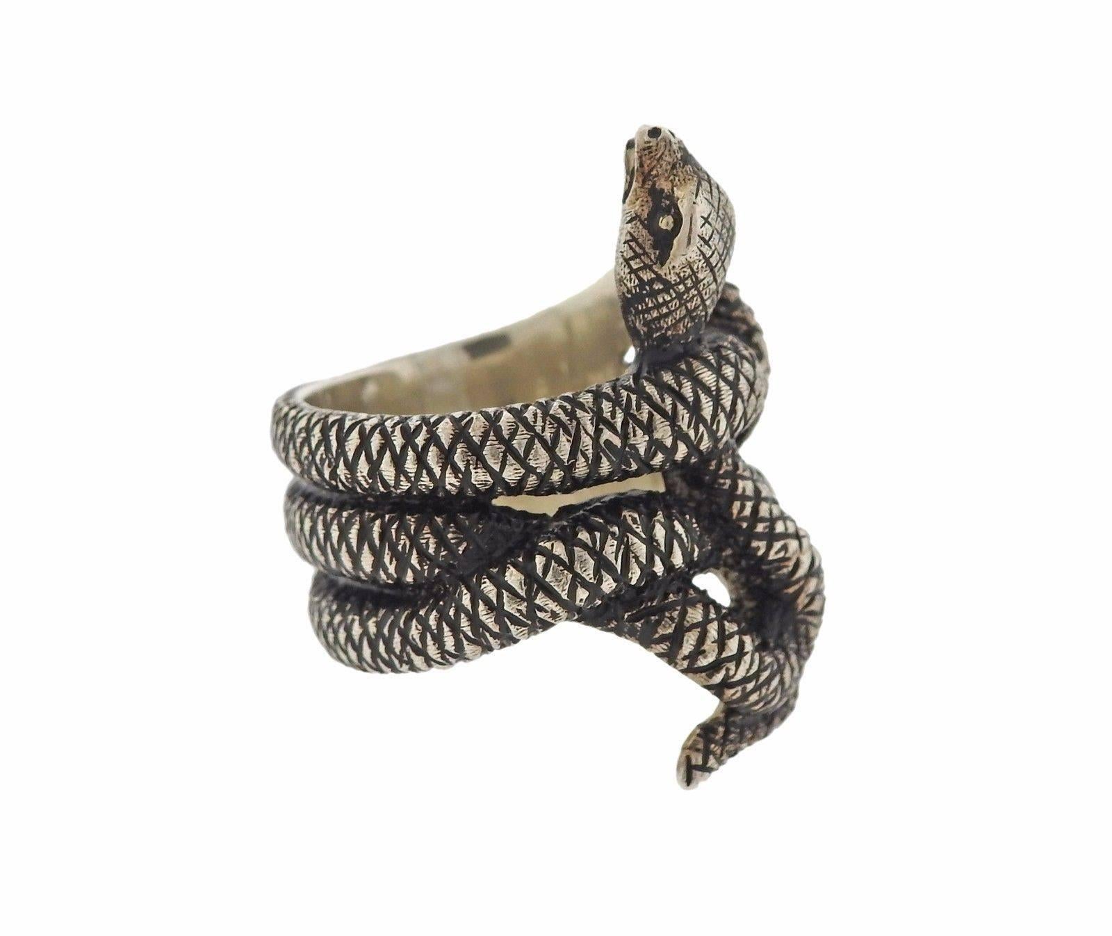 A sterling silver snake ring by Gianmaria Buccellati.  The ring is a size 6 and measures 29mm at the widest point.  The weight of the piece is 16.6 grams.  Marked: 925, Italy, Gianmaria Buccellati. Comes with Buccellati box and paperwork.  Current