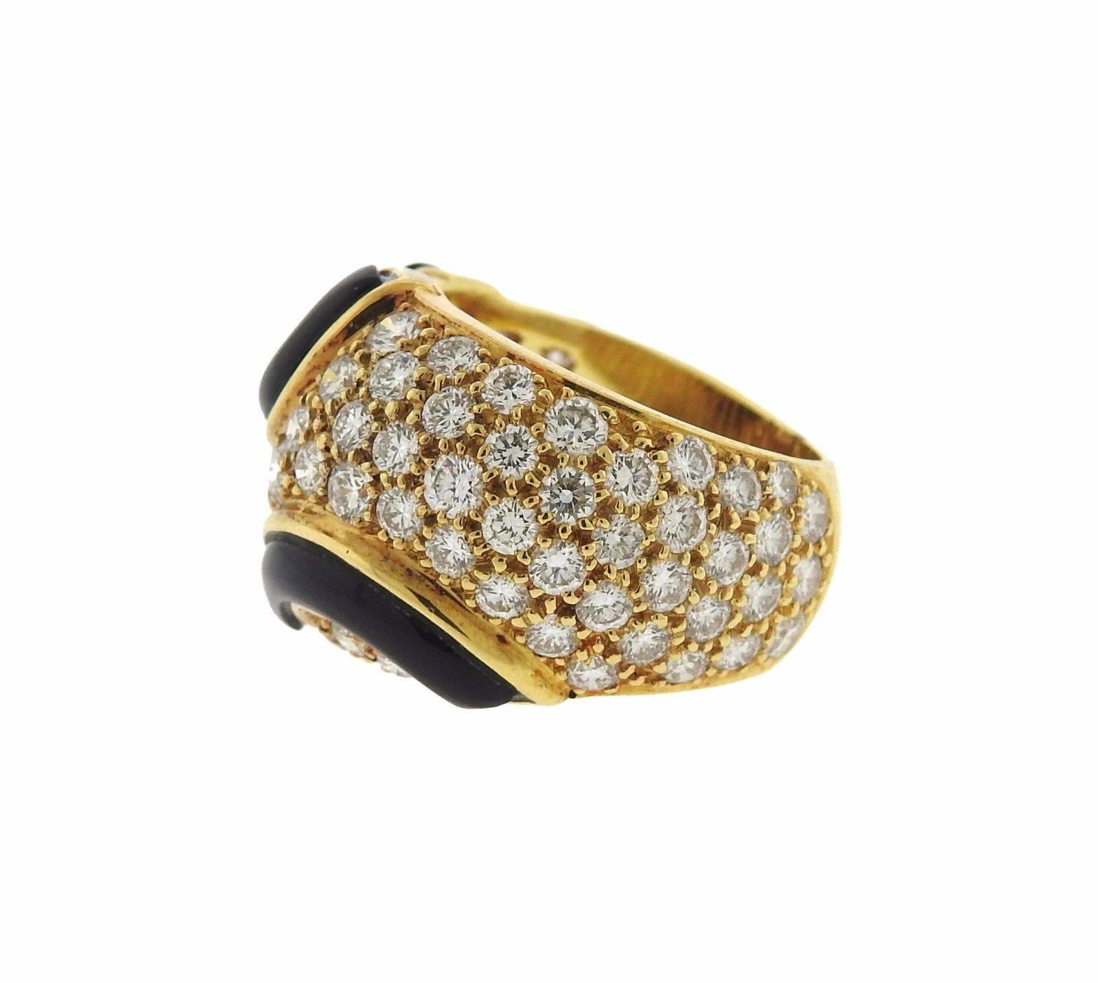 An 18k yellow gold ring set with 1.80ctw of G/VS diamonds and onyx.  The ring is a size 5.75 (can be made larger with sizing balls removed).  The weight of the piece is 10.9 grams.