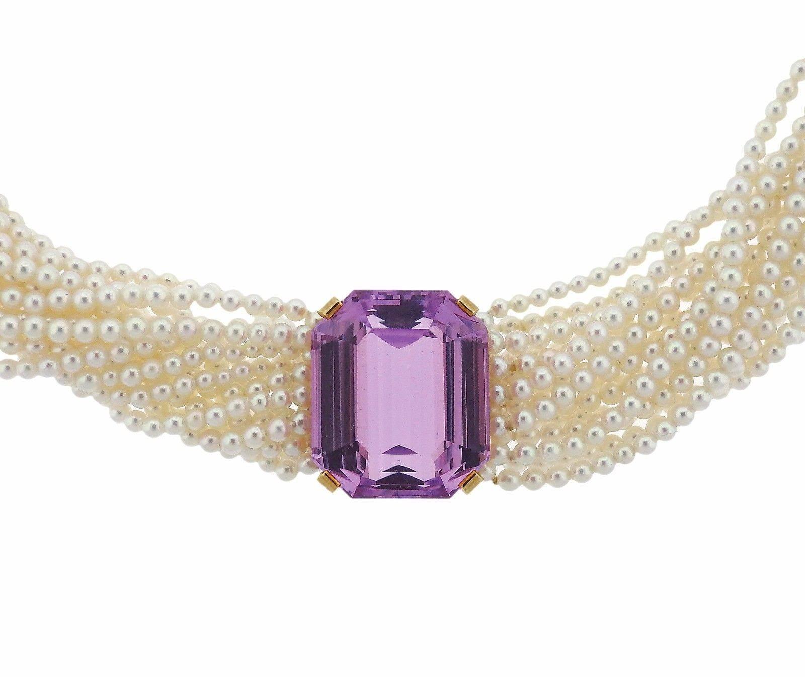 An 18k gold torsade necklace set with 2,5mm pearls and a kunzite measuring 20.8mm x 17.5mm.  The necklace is 13