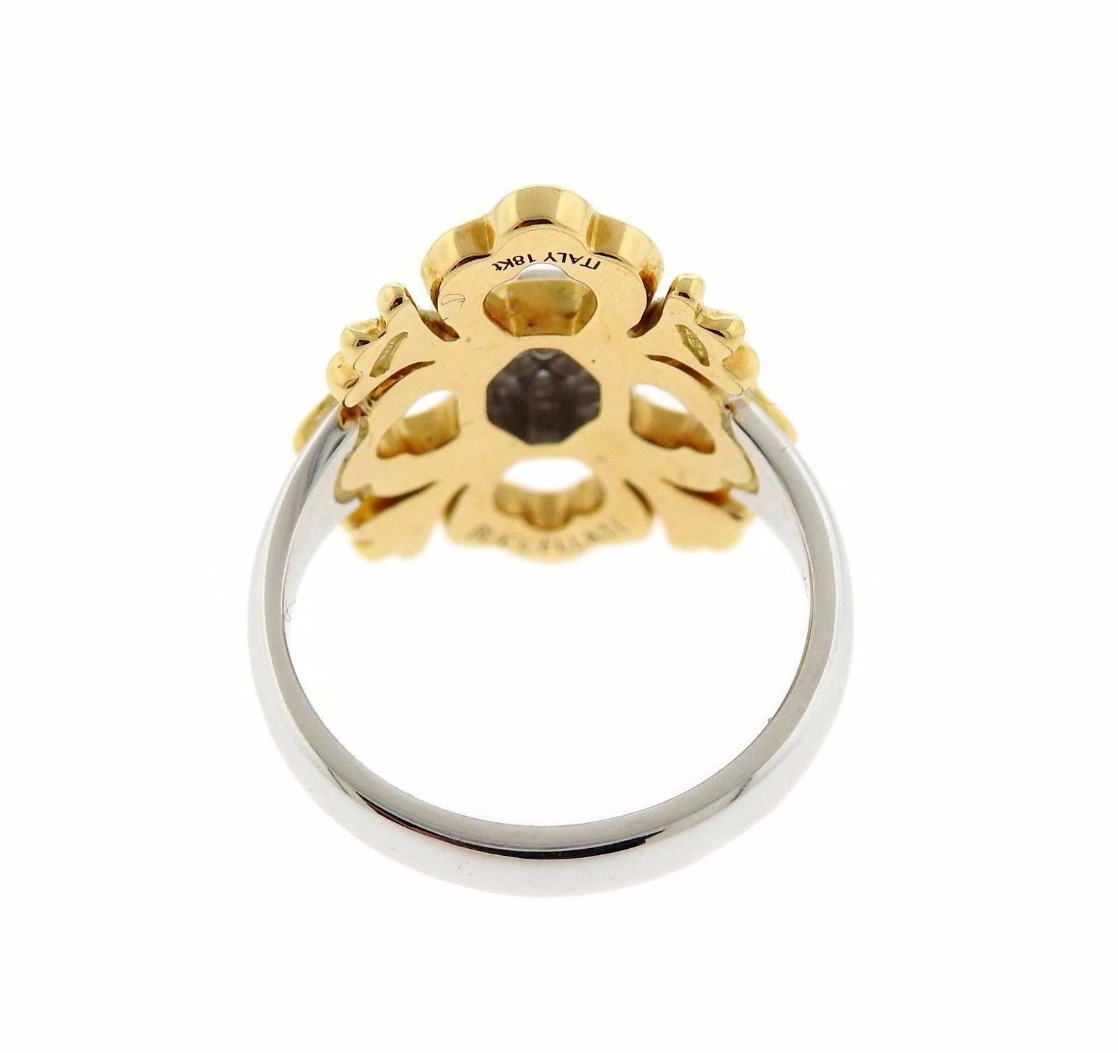 An 18k gold ring set with 0.05ctw of H/VS diamonds.  The ring is a size 5.75 and 20.3mm wide.  The weight of the piece is 6.4 grams.  Marked: Buccellati Italy 18K.