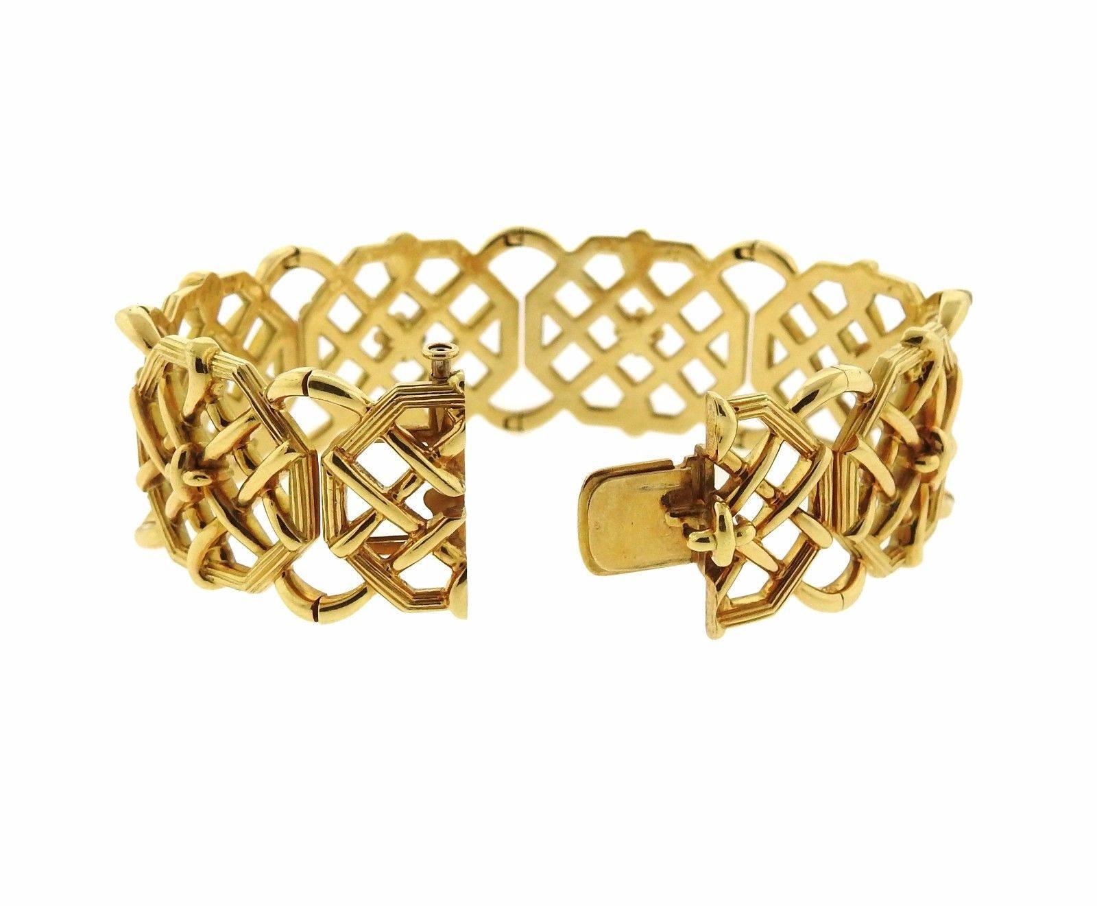 18k gold bamboo weave bracelet crafted by Schlumberger for Tiffany & Co. Bracelet will fit up to 6.75" wrist and measures 21mm wide. Marked tiffany & co schlumberger 750 and weighs 80.1 grams.  Current Retail $19,500.00