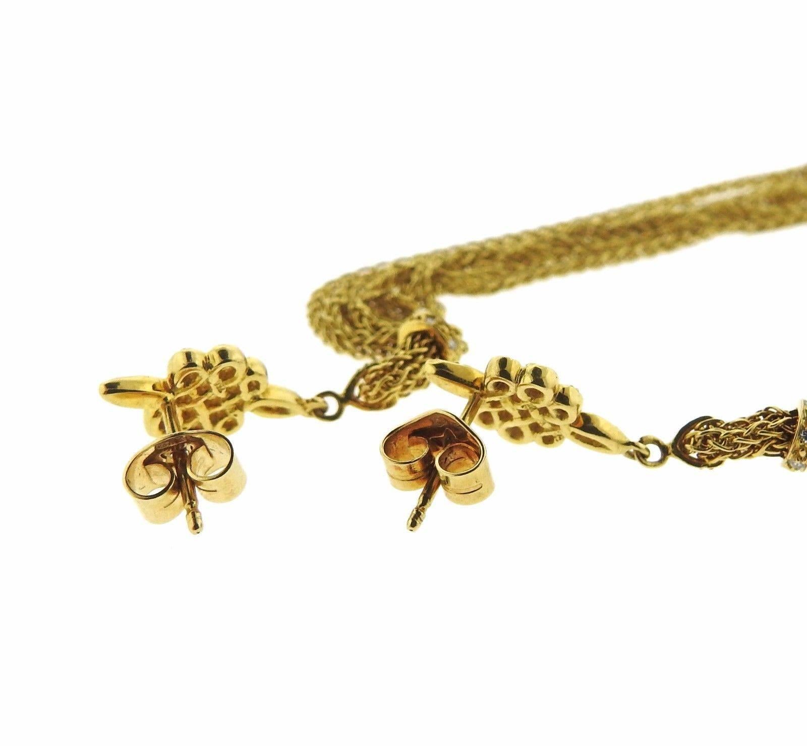 Lovely 18k gold tassel earrings crafted by Diane Von Furstenberg for H. Stern featuring diamonds. Earrings measure 113mm long, 9mm at widest point are marked maker's mark. Weigh 11.7 grams. 