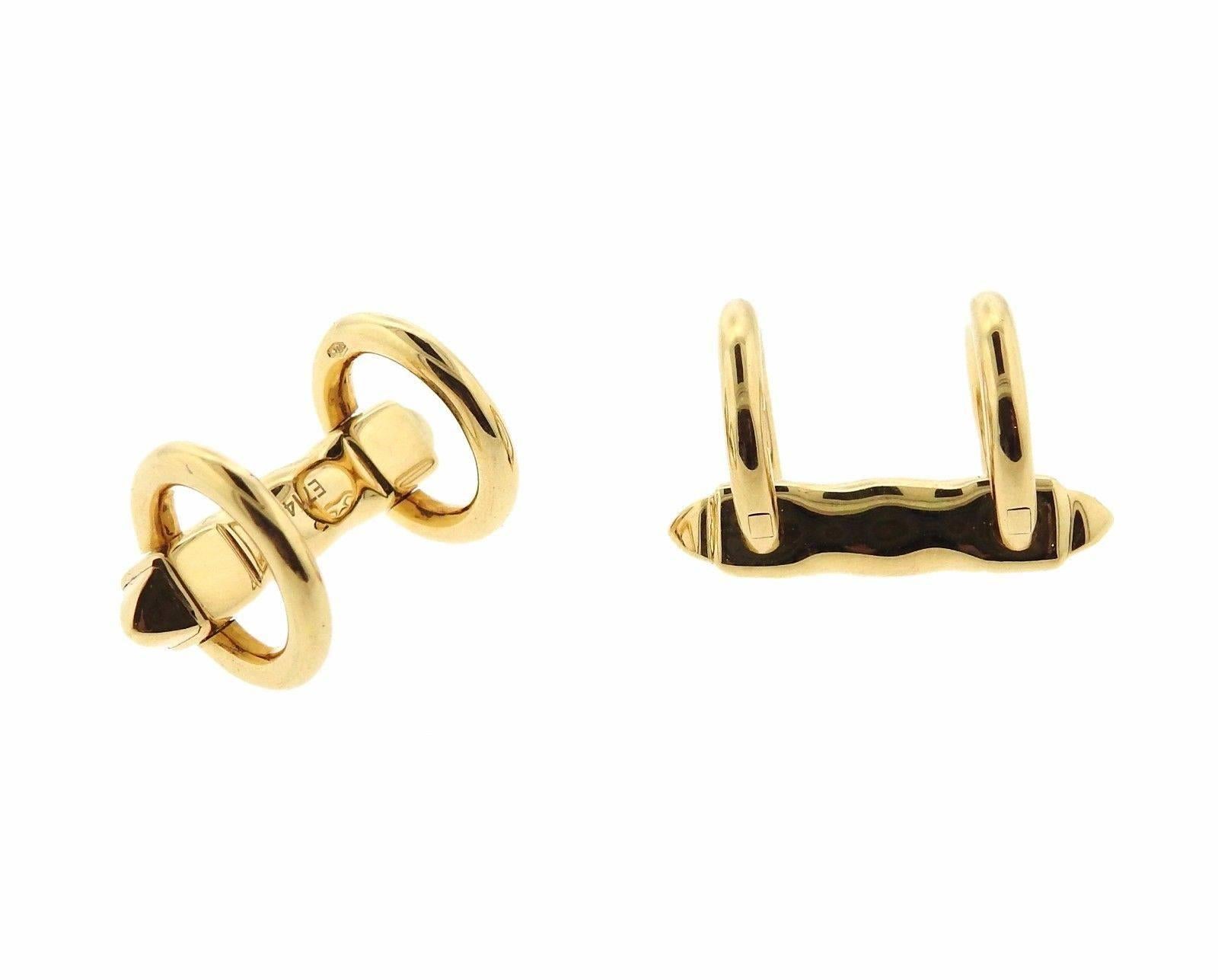 A pair of 18k gold horsebit cufflinks crafted by Cartier. Cufflink tops measure 13mm in diameter, marked Cartier E71462. Weight is 11.9 grams.