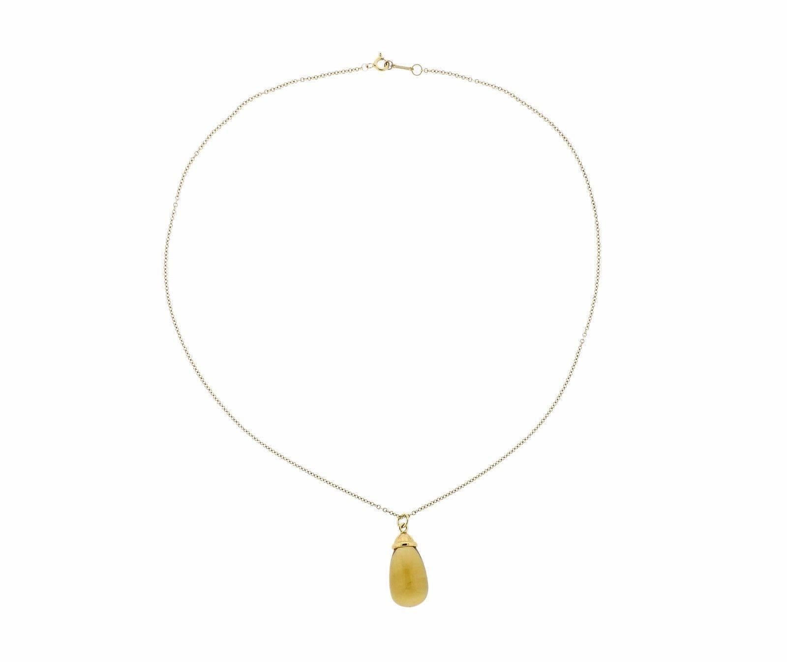 An 18k gold necklace set with a citrine (17.5mm x 12.5mm) pendant.  The necklace is 18" long and weighs 9 grams.  Marked: T & Co. 750 Paloma Picasso.
