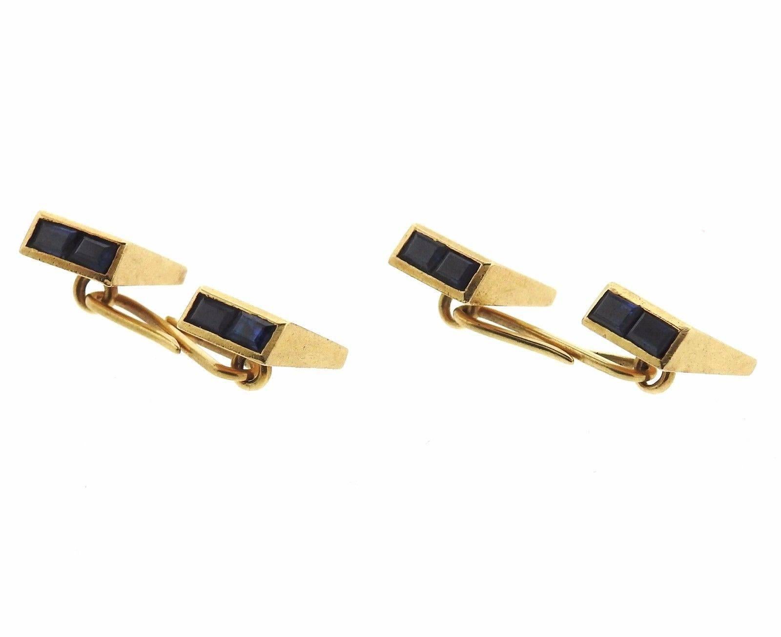 A pair of 14k gold cufflinks set with sapphires.  The cufflinks measure 13mm x 9mm.  The weight of the set is 11 grams.