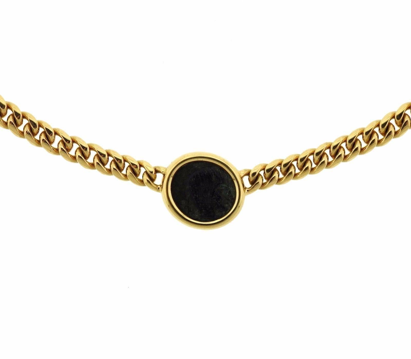 An 18k gold necklace set with an ancient coin.  The necklace is 16.5" long and the coin in bezel measures 13.5mm in diameter.  The weight of the piece is 40 grams.  Marked: Bvlgari, 750, Made in Italy, Lydia, 4th Century BC.