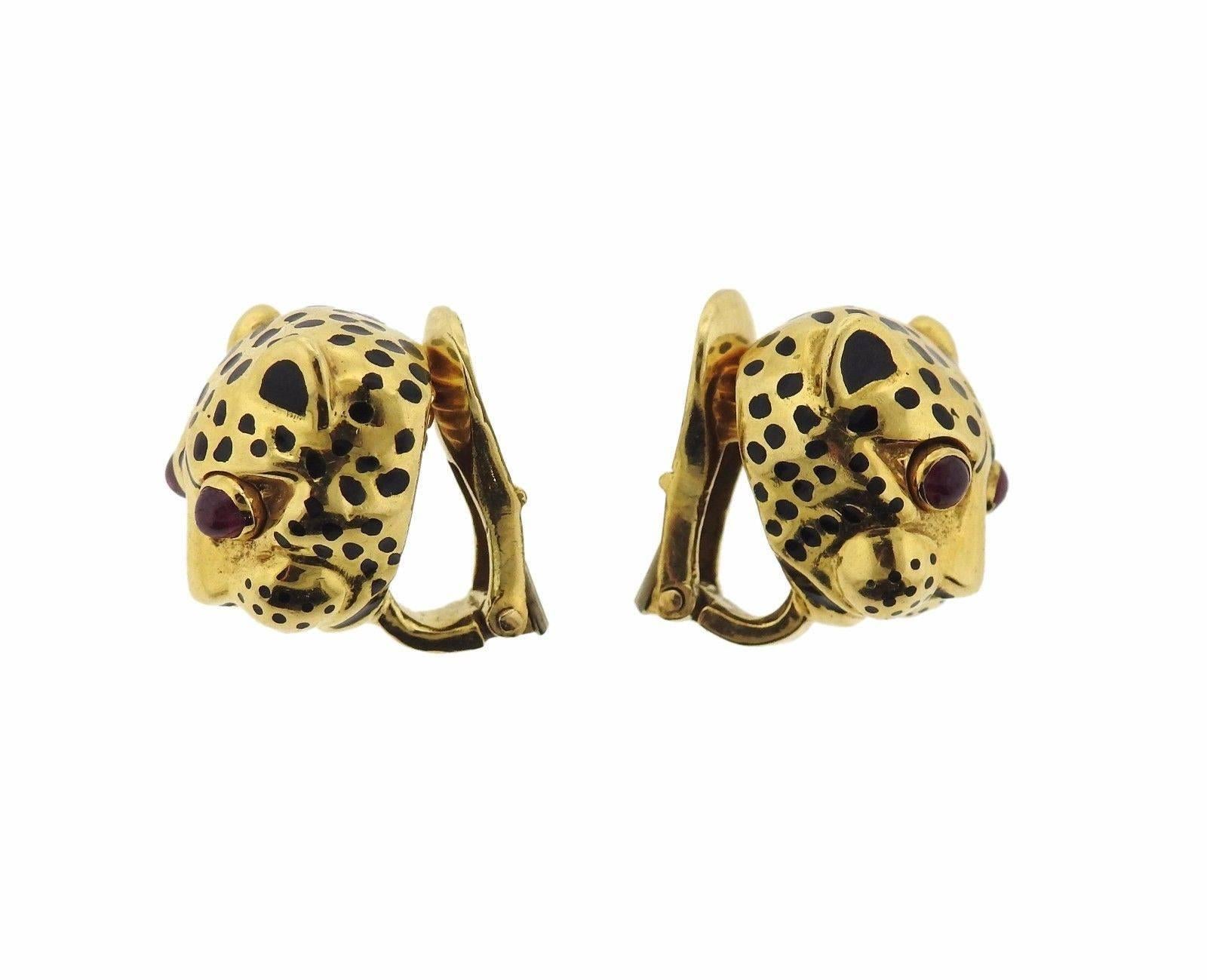 A pair of 18k gold earrings depicting leopards, with ruby cabochons for eyes.  The earrings measure 14.7mm x 12mm and weigh 13.8 grams.  Marked: WEBB 18K.  The earrings come with a David Webb box.