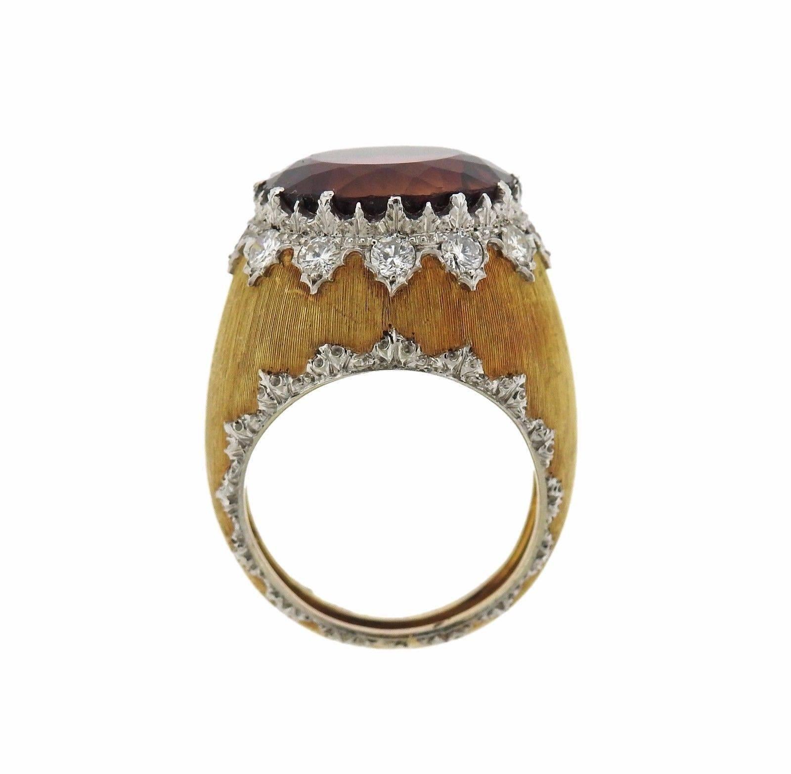 An 18k yellow gold ring set with a tourmaline and approximately 0.50ctw.  The ring is a size 5.75 and 17mm wide.  The weight of the piece is 10.9 grams.  Marked: M. Buccellati, Italy, 750.