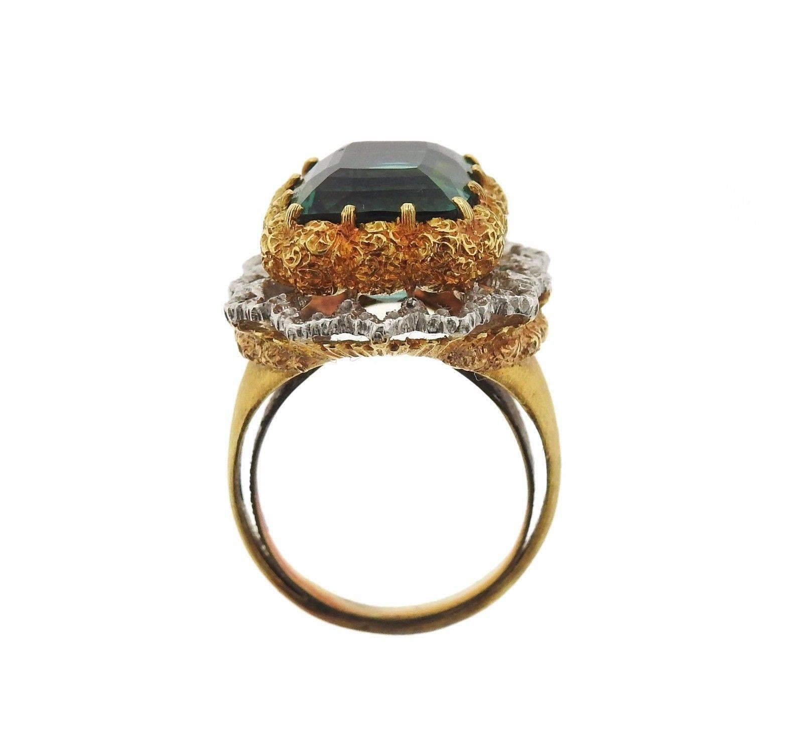 An 18k gold ring set with a tourmaline (11mm x 10mm).  The ring is a size 5.75 and is 18mm wide. The weight of the ring is 11.5 grams.  Marked: Buccellati, Italy, K18.