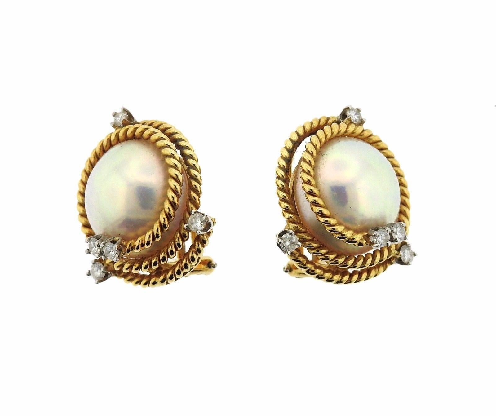 A pair of 18k gold earrings set with pearls and 0.52ctw of G/VS diamonds.  The earrings measure 21mm x 22mm.  Marked: Tiffany & Co, Schlumberger, 750.  The weight of the pair is 21.5 grams.  Current retail is $7600.