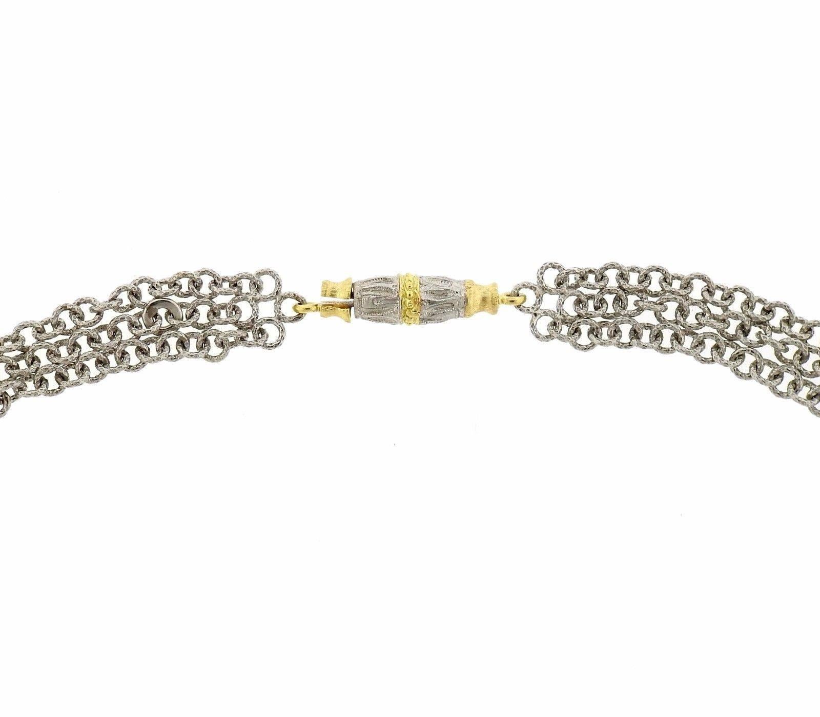 An 18k gold necklace set with approximately 2.54ctw of rose cut diamonds.  The shortest strand of the necklace measures 16.5" long and the stations are 4.65mm in diameter.  The weight of the piece is 26.8 grams.  Marked: Gianmaria Buccellati