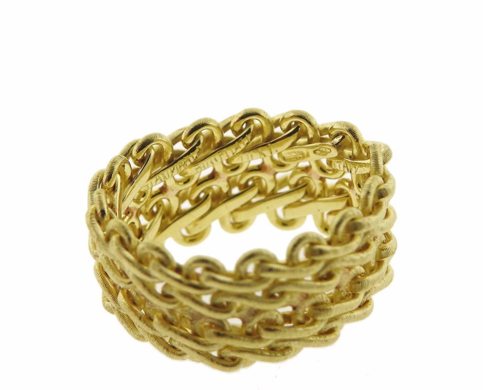 An 18k yellow gold ring by Gianmaria Buccellati.  The ring is a size 6 and is 11.5mm wide.  The weight of the piece is 10 grams.  Marked: Gianmaria Buccellati 750 Italy 18kt.  The current retail is $3760.
